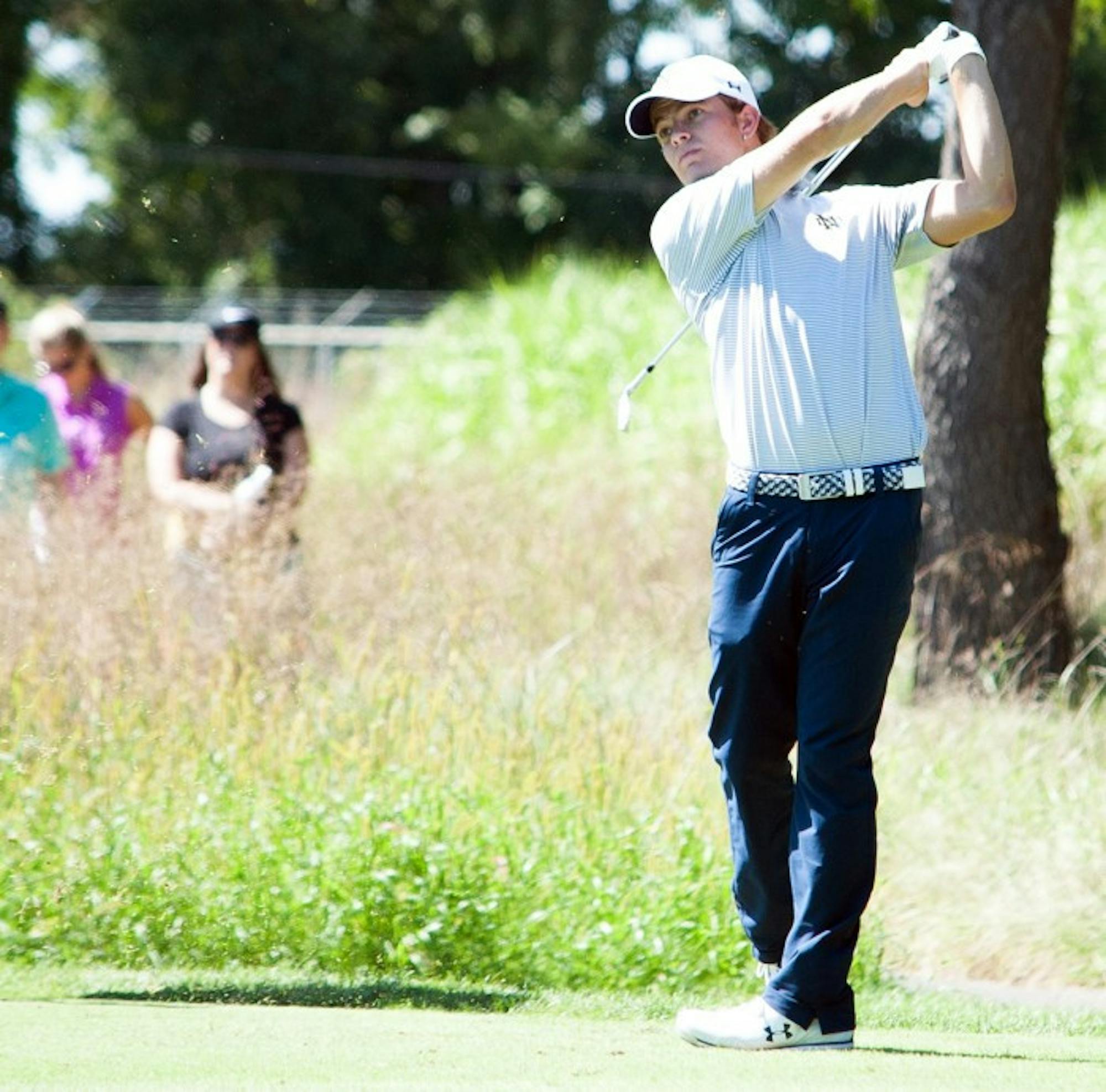 Senior Blake Barens follows through on a swing during the Notre Dame Kickoff Challenge on Sept. 3 at Warren Golf Course.