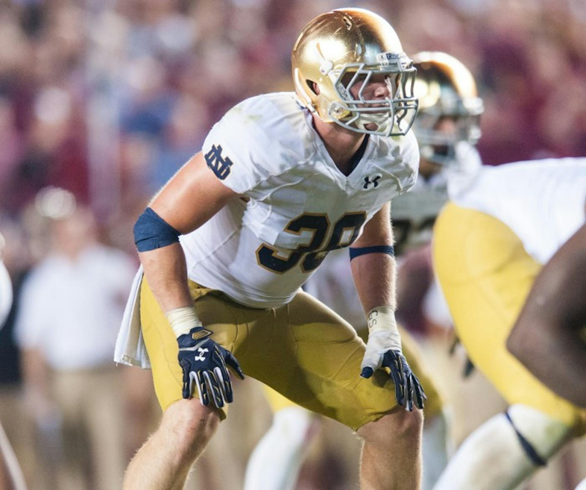 Senior linebacker Joe Schmidt readies for the snap during the Oct. 18 loss to Florida State. Schmidt suffered a season-ending injury Saturday against Navy.