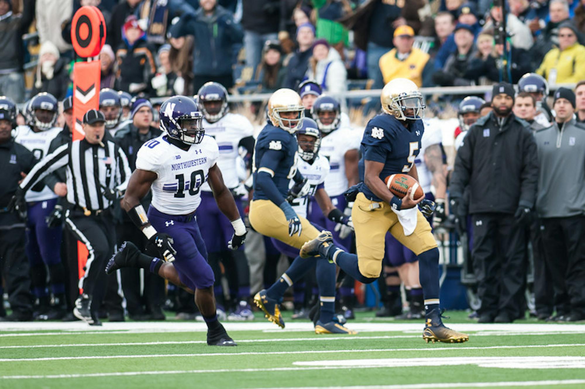 Irish senior quarterback Everett Golson sprints for a 61-yard touchdown in the first quarter.