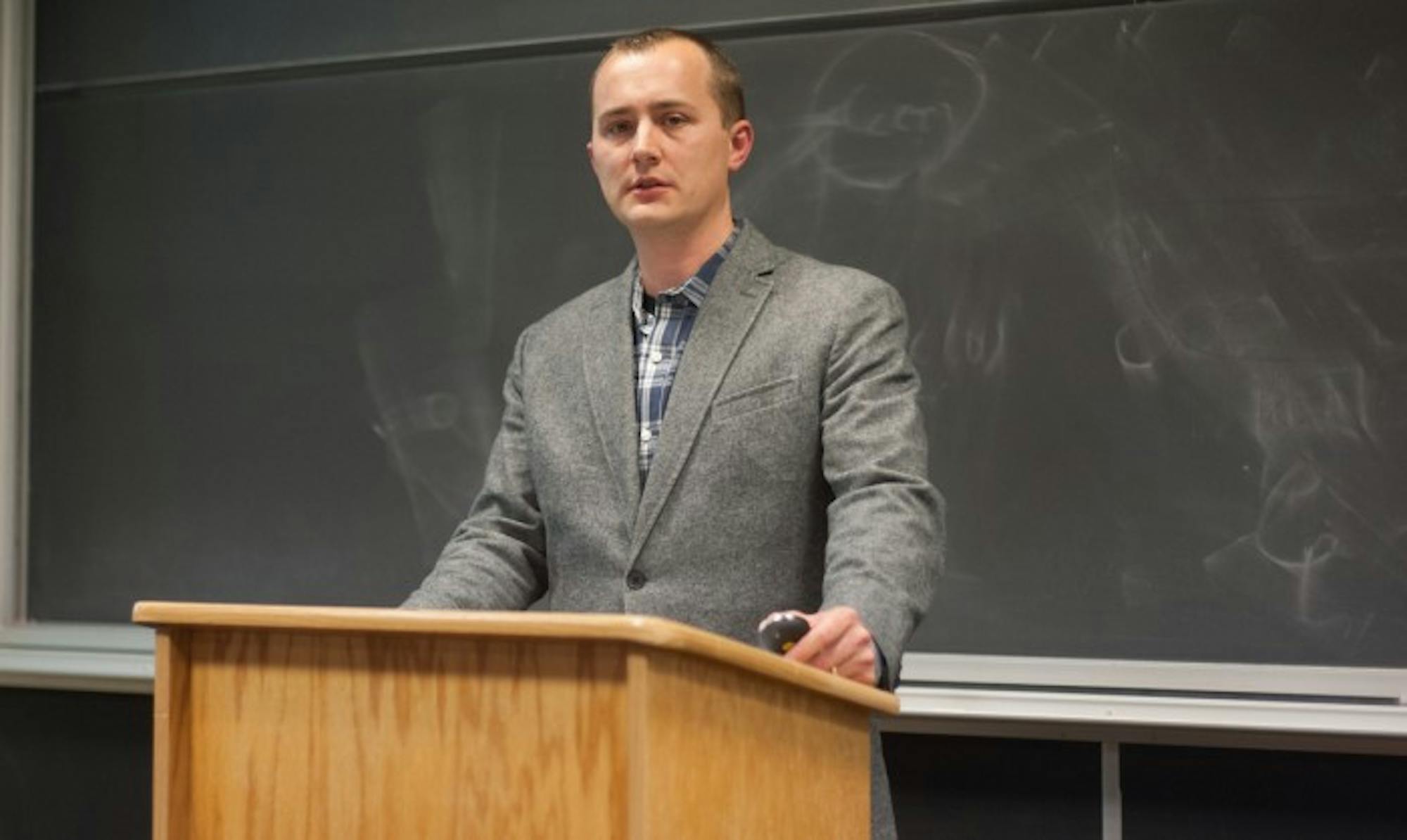 Jeffery Luppes, assistant professor of German at Indiana University South Bend, delivers a lecture in  DeBartolo Hall on German wartime suffering and the experiences of German evacuees after the war.