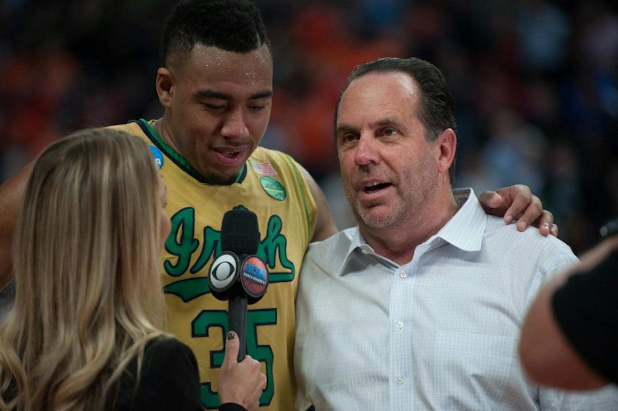 Irish junior forward Bonzie Colson and head coach Mike Brey talk to a reporter following their 60-58 win over Princeton in the NCAA tournament Thursday.