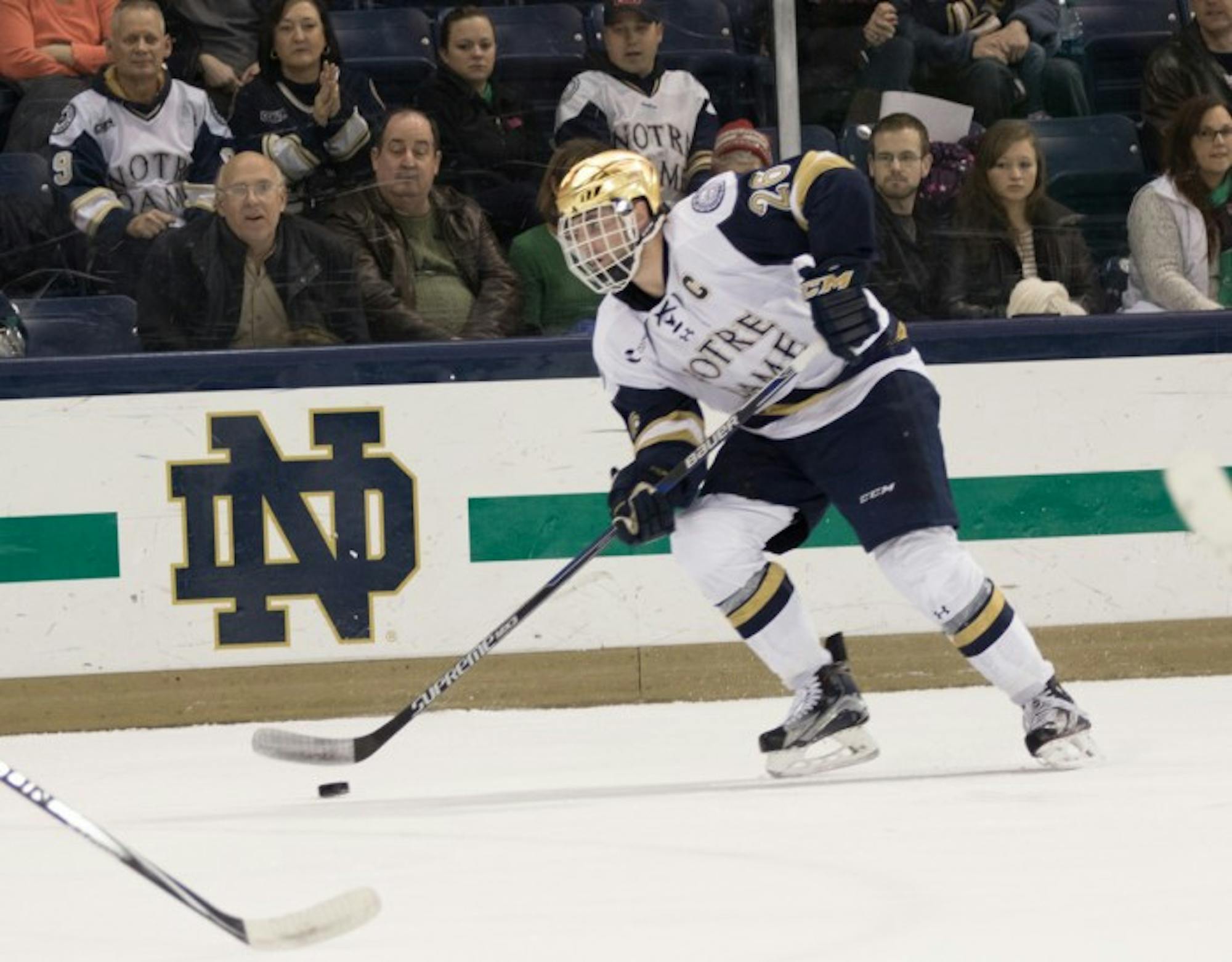 Senior center Steven Fogarty controls the puck during Notre Dame’s 3-1 victory over Massachusetts on Friday at Compton Family Ice Arena. Fogarty scored one goal in the win.
