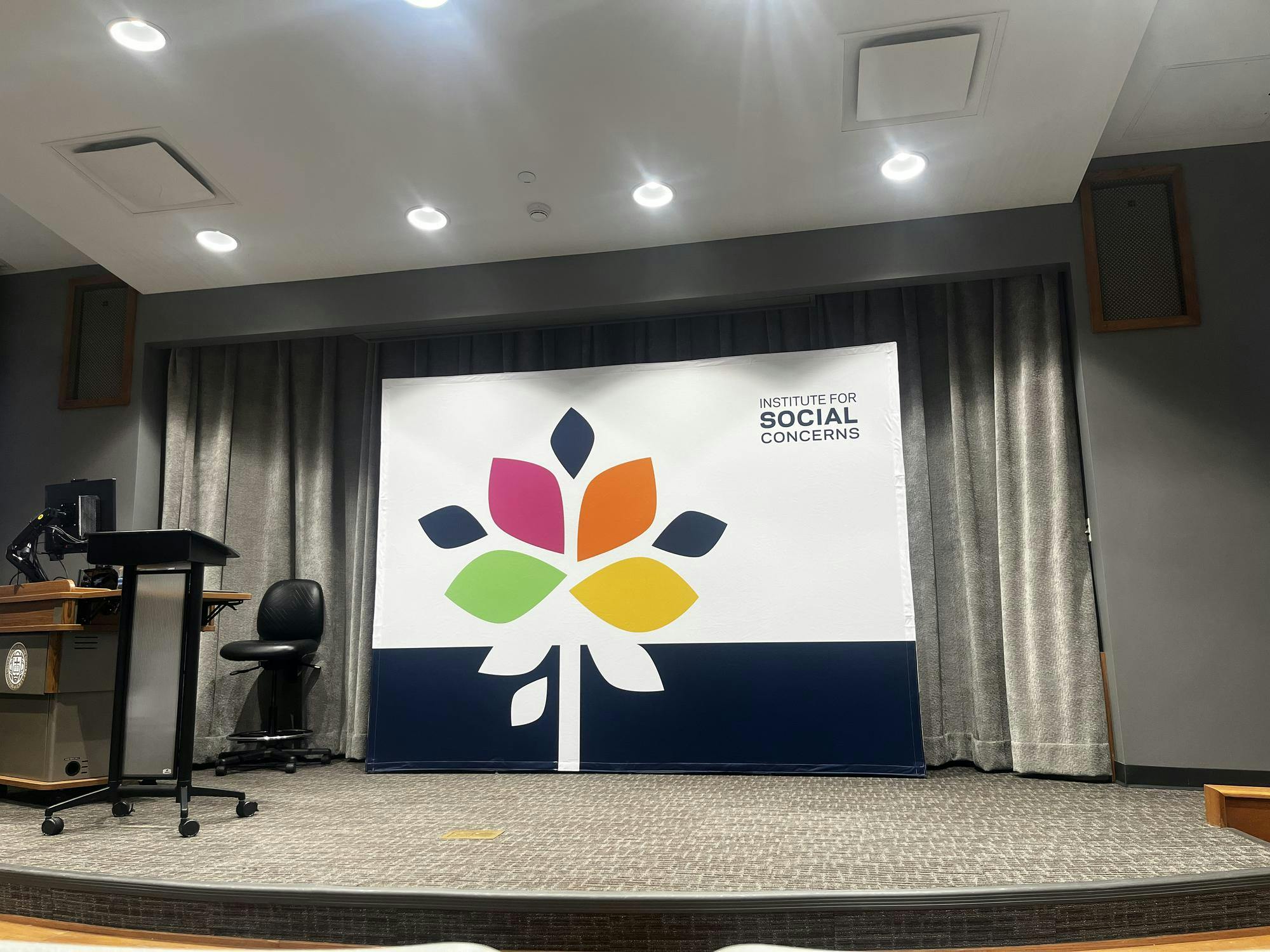 Institute for Social Concerns sign shown at Geddes Hall lecture.jpeg