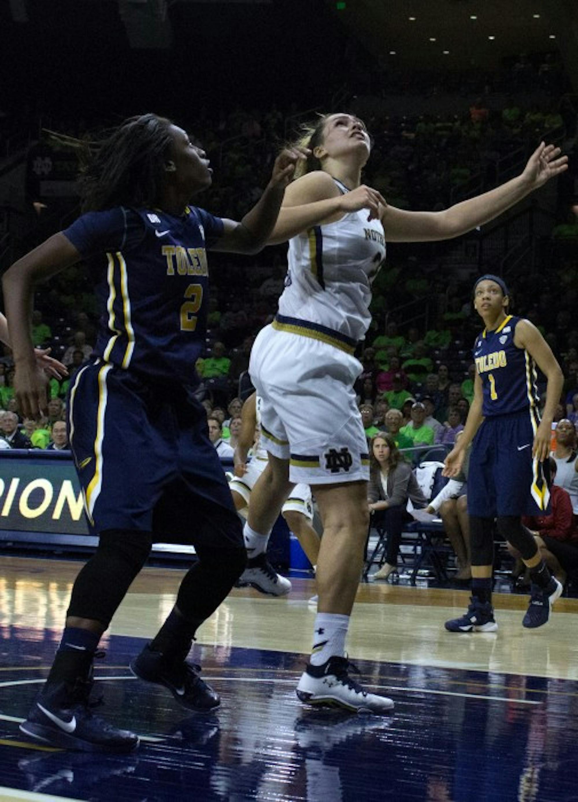 Irish sophomore forward Kathryn Westbeld jostles for position with a Toledo player during Notre Dame's 74-39 win over the Rockets on Nov. 18 at Purcell Pavilion.
