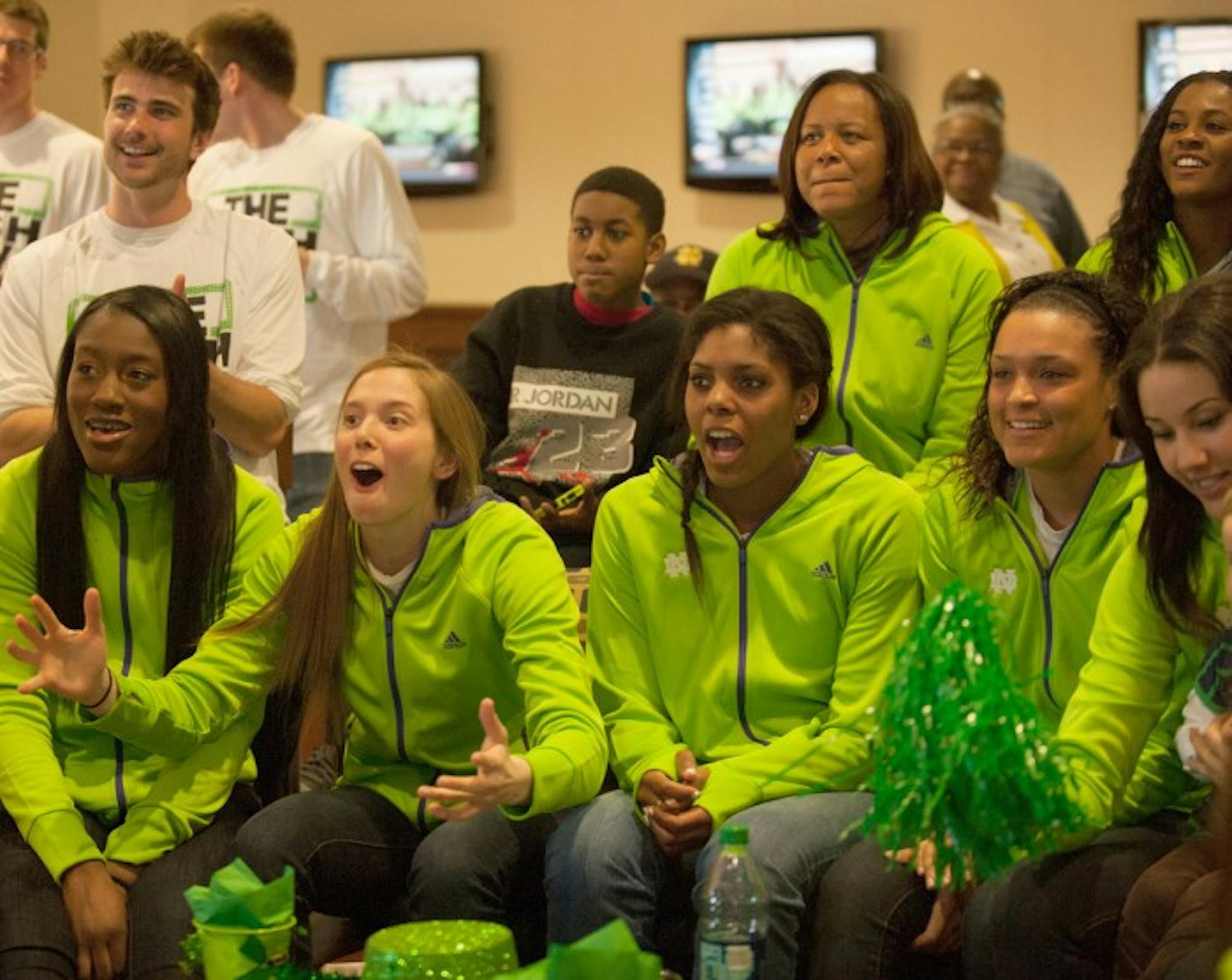 Members of the Notre Dame women's basketball team react to the announcement of their No. 1 seed in the NCAA tournament Monday.