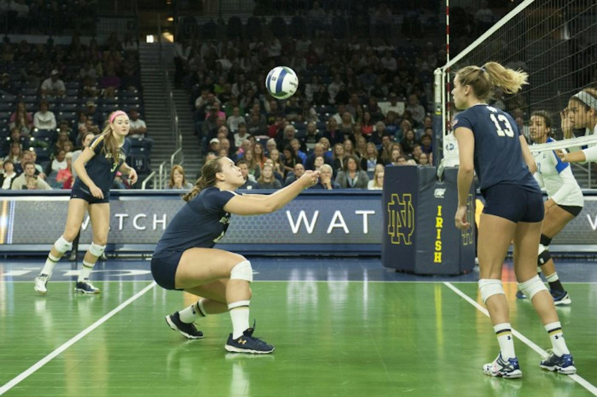 Irish senior middle blocker Jeni Houser digs a shot during Notre Dame’s 3-1 loss to Duke on Sunday at Purcell Pavilion. Houser is second on the team in kills per set.