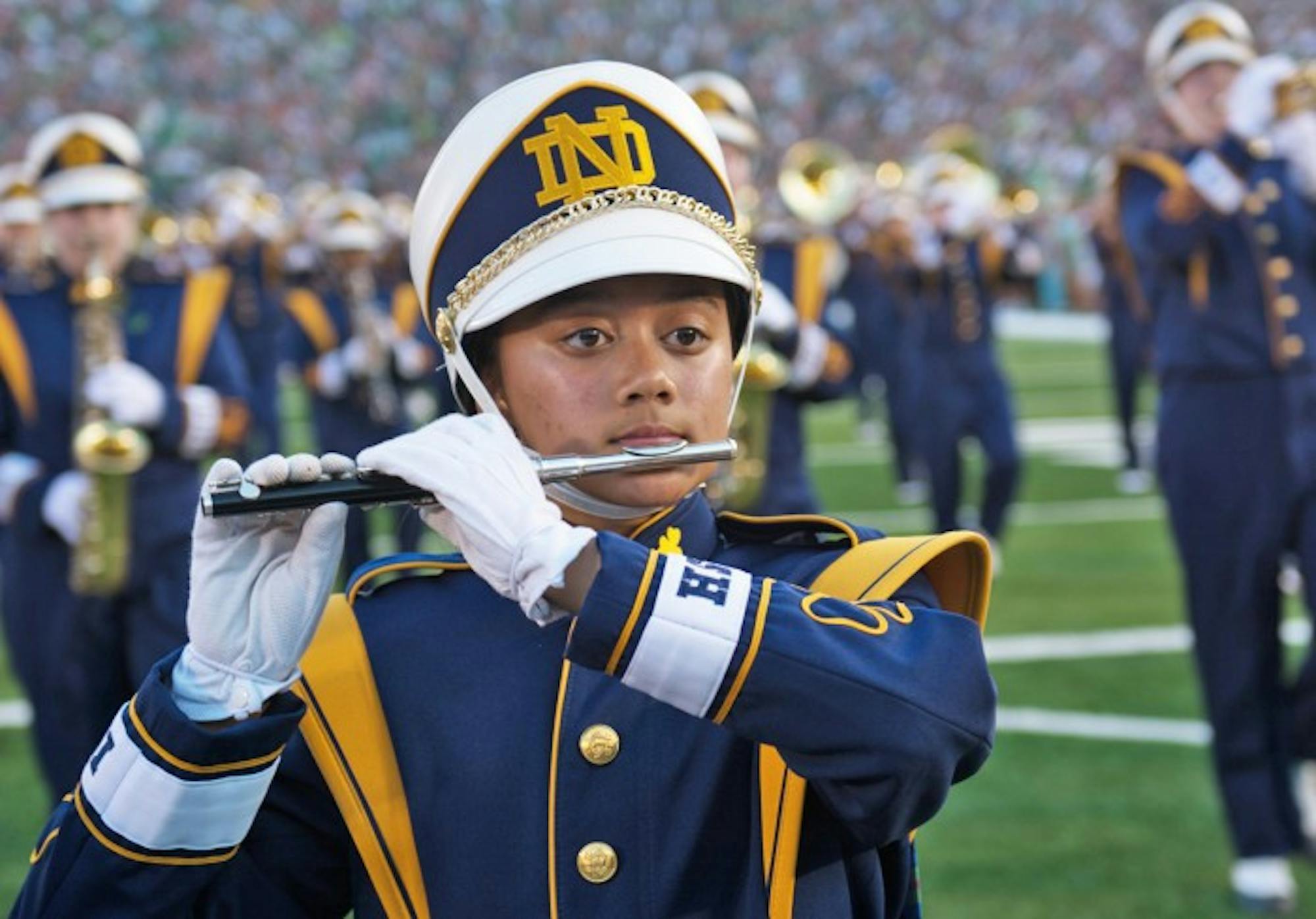 Senior Kim Forbes marches onto the field at Notre Dame Stadium. The band will relocate for the 2017 season, moving from an on-field location in the northeast corner of the stadium to the front of the student section.