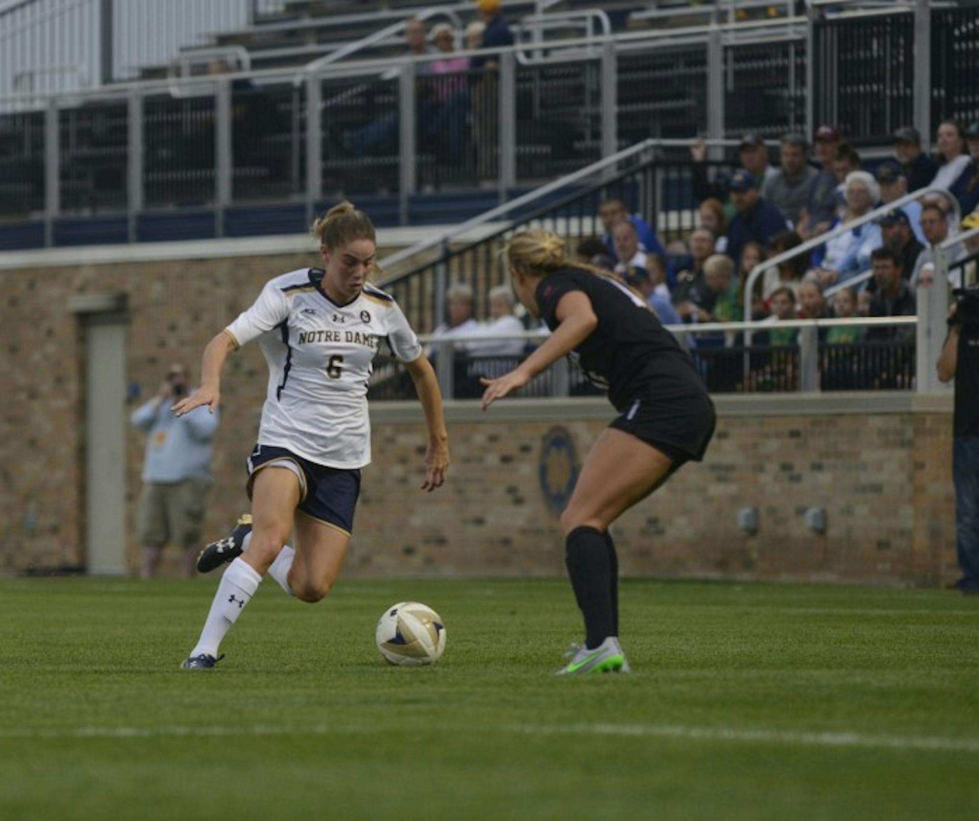Irish senior forward Anna Maria Gilbertson attempts to get past a defender against during a win on Aug. 28 at Alumni Stadium.