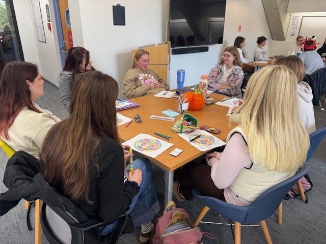 Tutors at the Writing and Tutoring Center train with each other