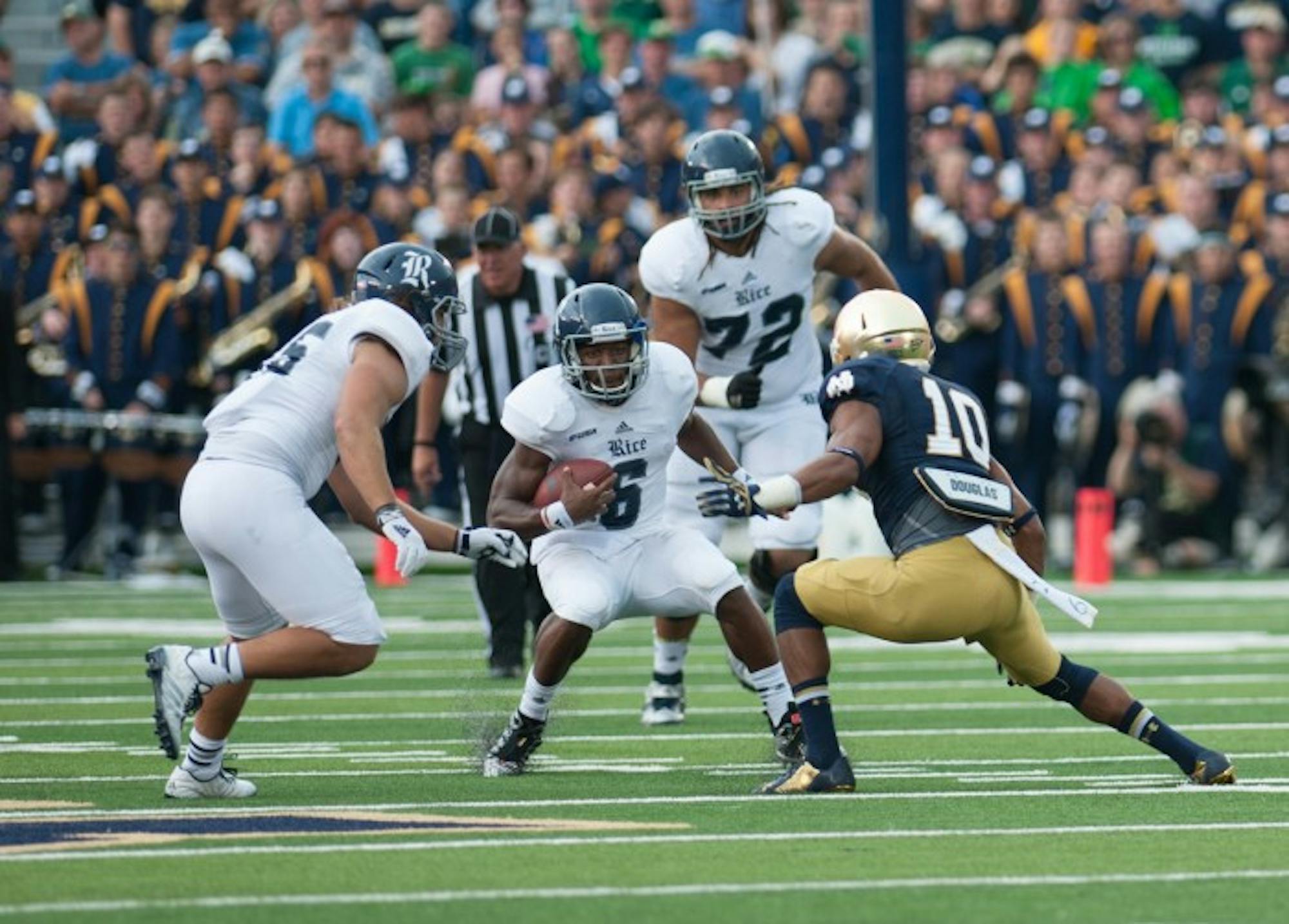 rish sophomore safety Max Redfield prepares to tackle the ballcarrier in Notre Dame’s 48-17 victory against Rice on Saturday. Refield made his second career start in the game.