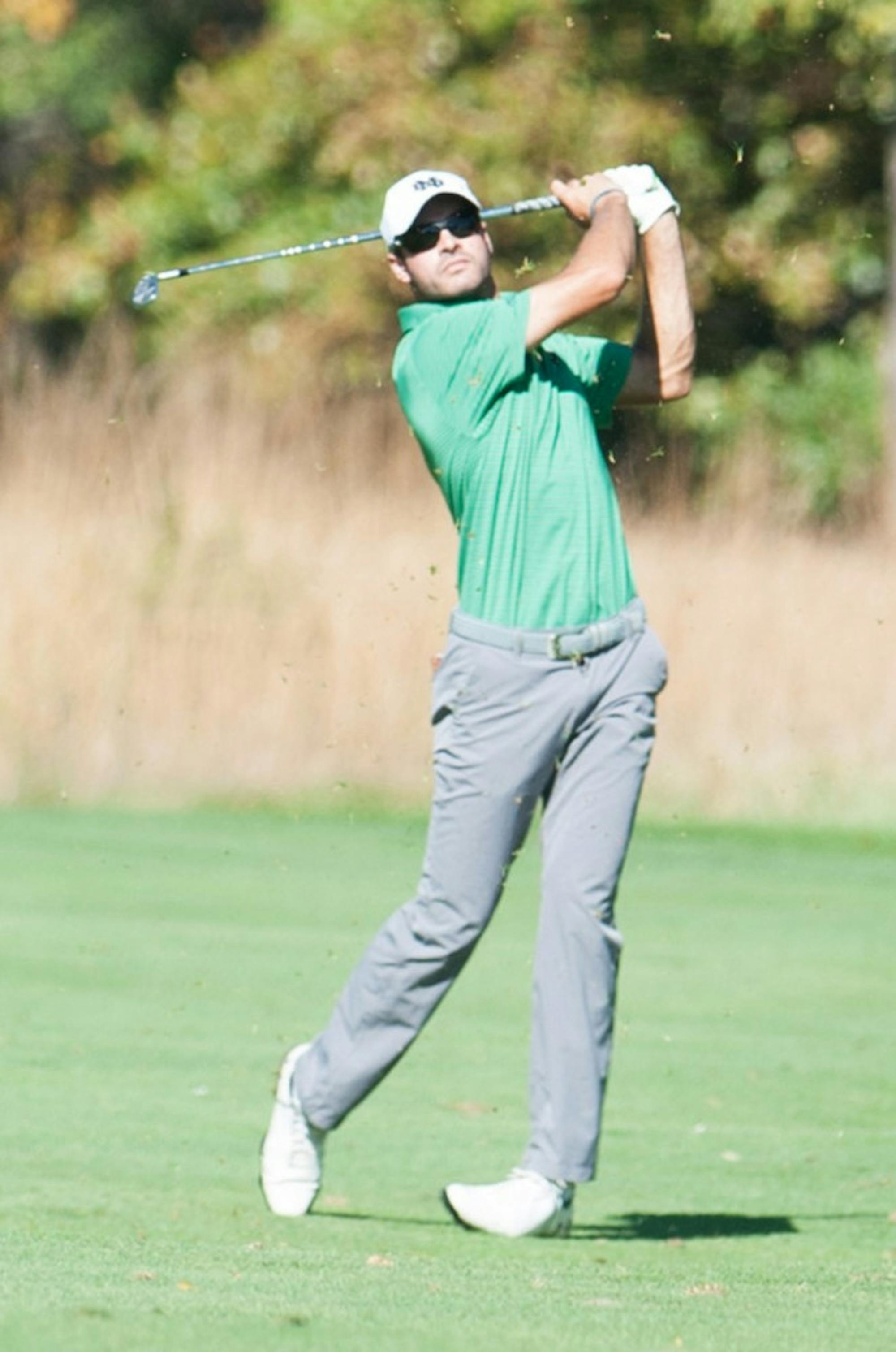 Irish junior Miguel Delgado follows through on an iron during the Fighting Irish Classic on Oct. 8 at Warren Golf Course.