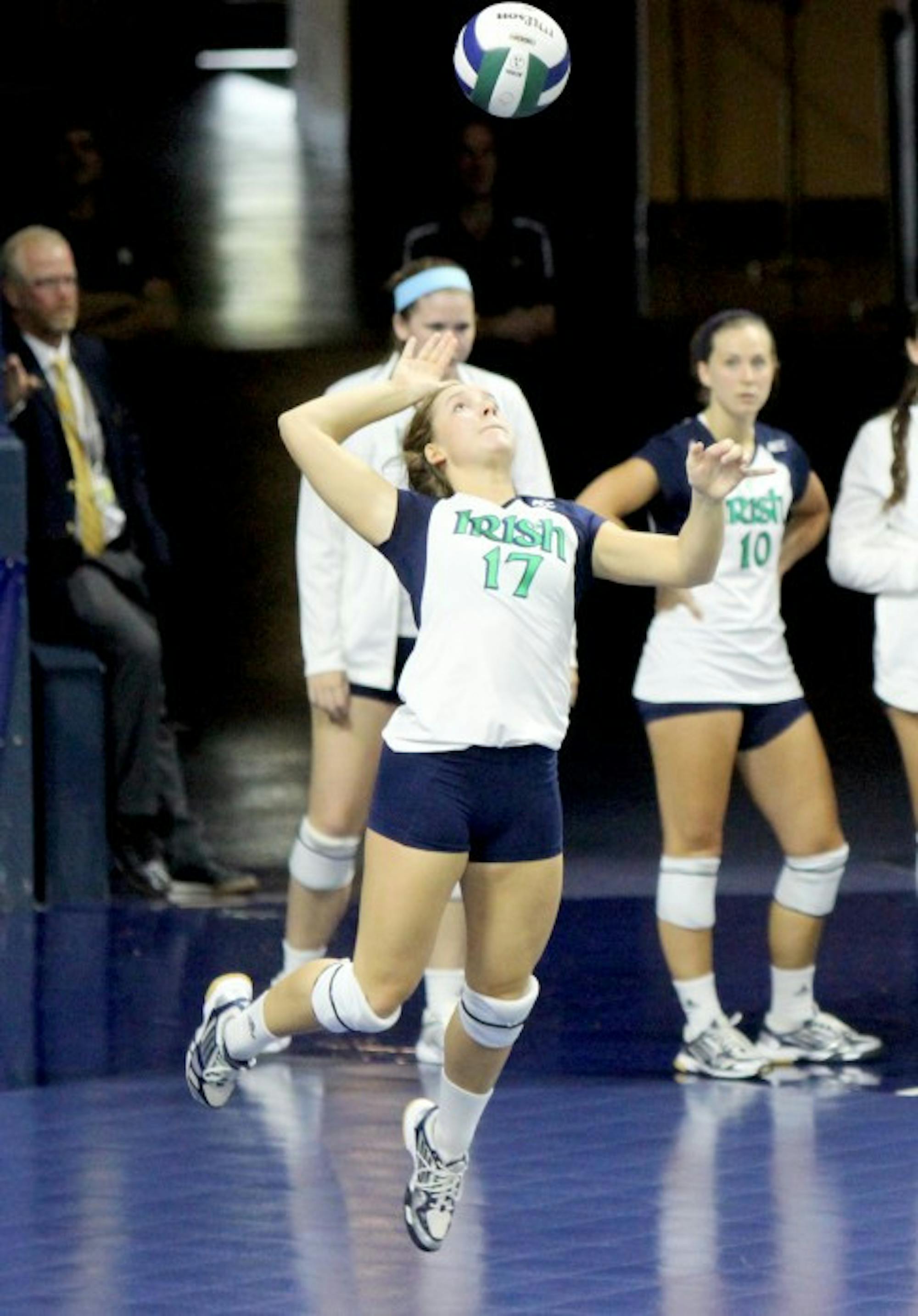 Irish senior libero Erin Klosterman goes up for a serve against Polish club team Dabrowa in an exhibition match Sept. 8, 2013 at Purcell Pavilion.