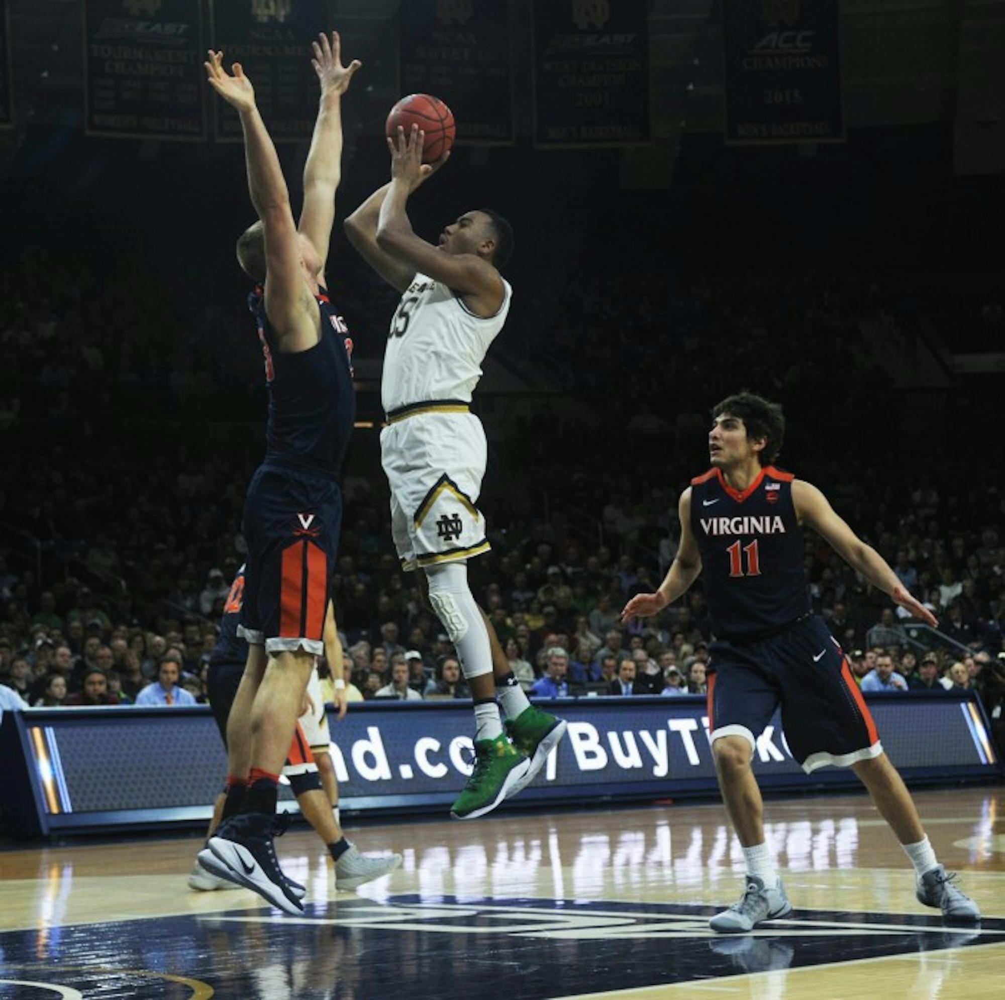 Irish junior forward Bonzie Colson shoots over a Virginia defender during Notre Dame’s 71-54 loss to the Cavaliers on Jan. 24 at Purcell Pavilion. Colson paced the Irish with 27 points and 16 rebounds Tuesday.