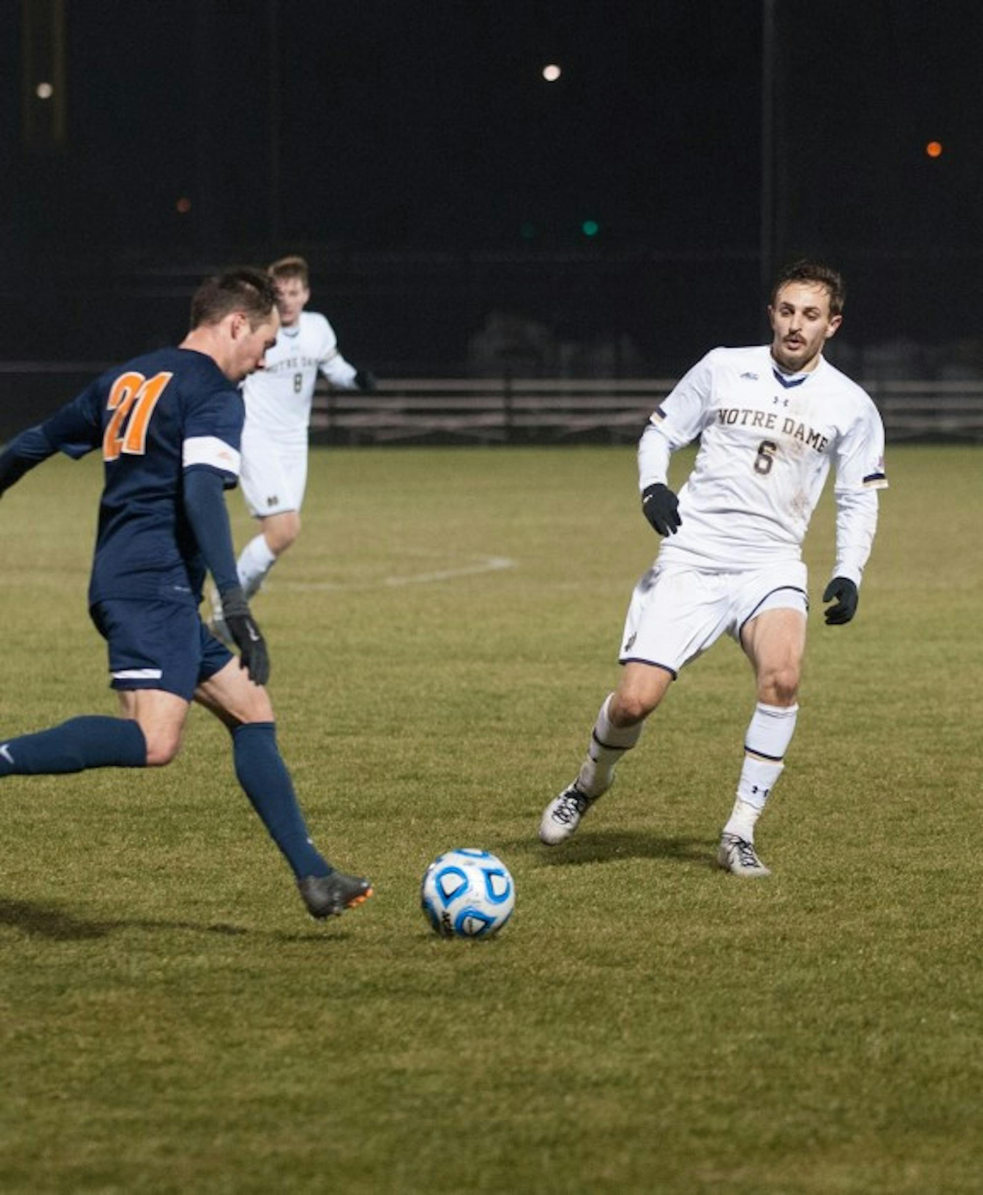 Senior Irish defender Max Lachowecki marks his opponent in Notre Dame’s 1-0 loss to Virginia in the third round of the NCAA Championships on November 30.
