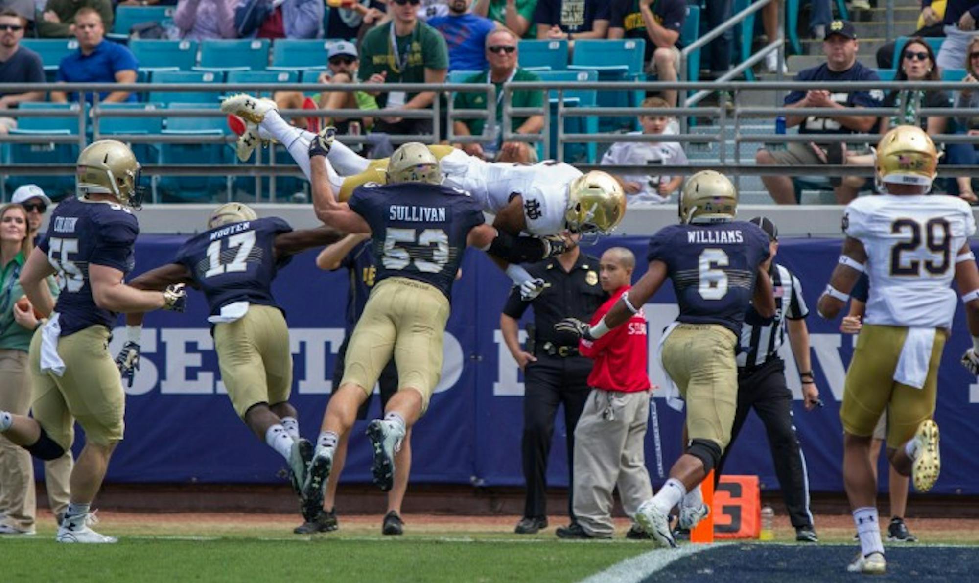 Irish sophomore receiver Eqaunimeous St. Brown flips into the end zone during Notre Dame's 28-27 loss to Navy on Saturday in Jacksonville. St. Brown had 62 receiving and one touchdown on the day.
