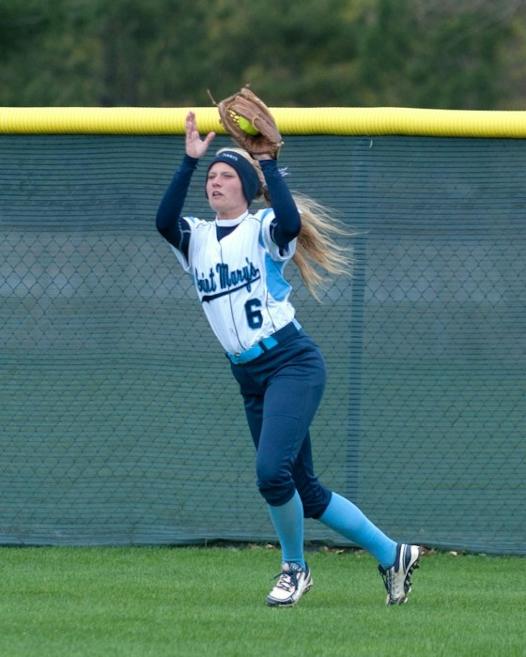Freshman Cassie Young fields a fly ball during a 9-6 win against Kalamazoo on April 21 at Saint Mary's Softball Field.