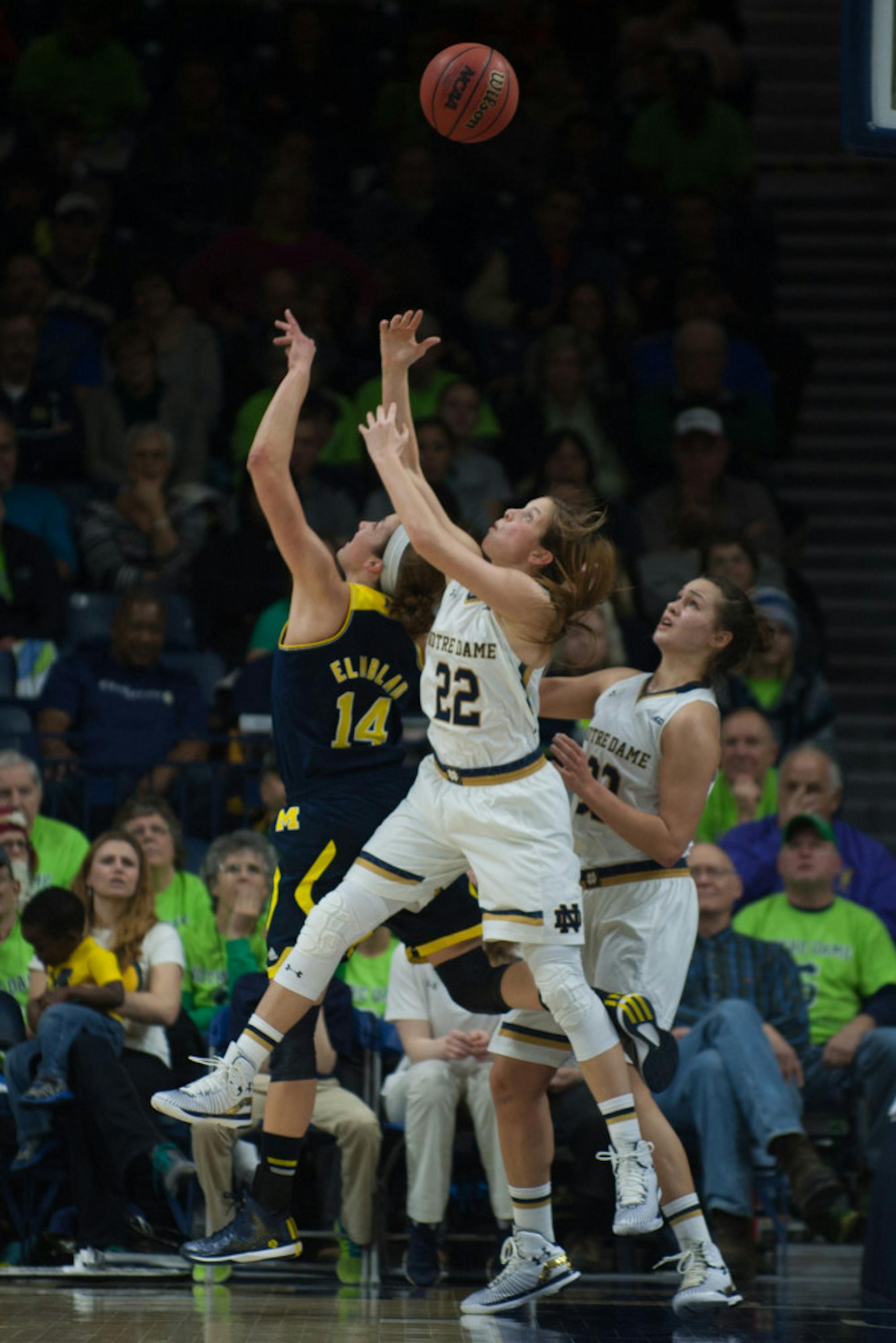 Irish senior guard Madison Cable leaps for a rebound during a 70-50 win over Michigan on Dec. 13 at Purcell Pavilion.