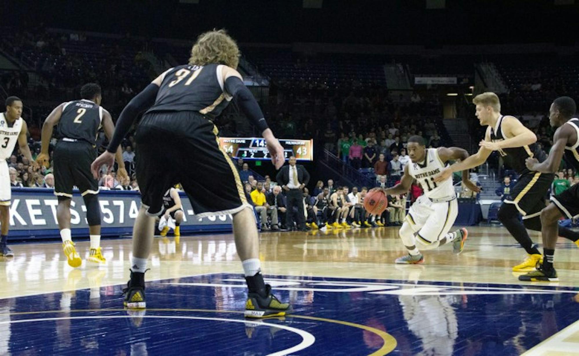 Junior guard Demetrius Jackson breaks through the Milwaukee defense during Notre Dame’s 86-78 victory Tuesday night at Purcell Pavilion. Jackson totaled 20 points in the win.