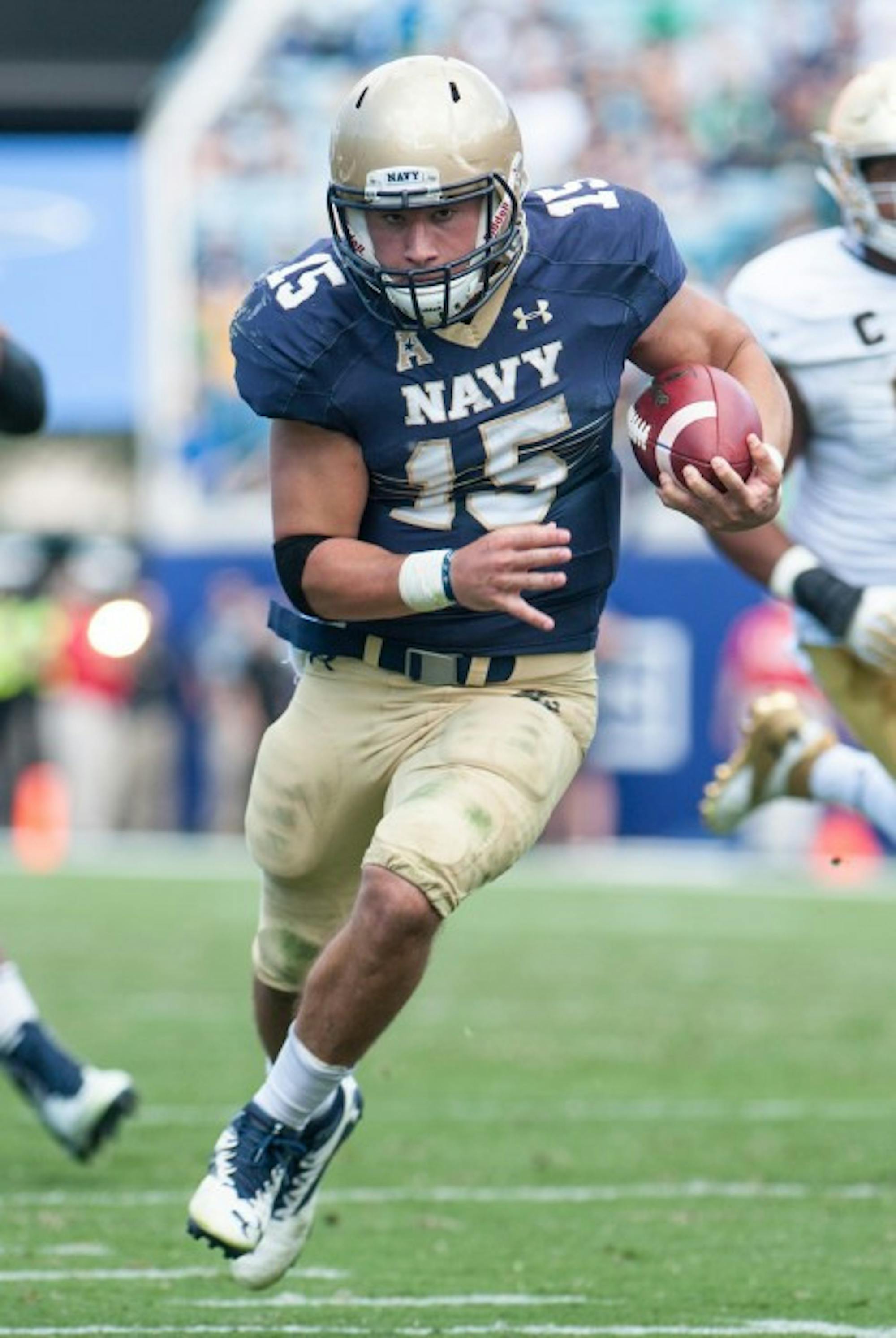 Navy QB Will Worth scrambles up the field to set Navy up for a touchdown in the beginning of the 4th Quarter.