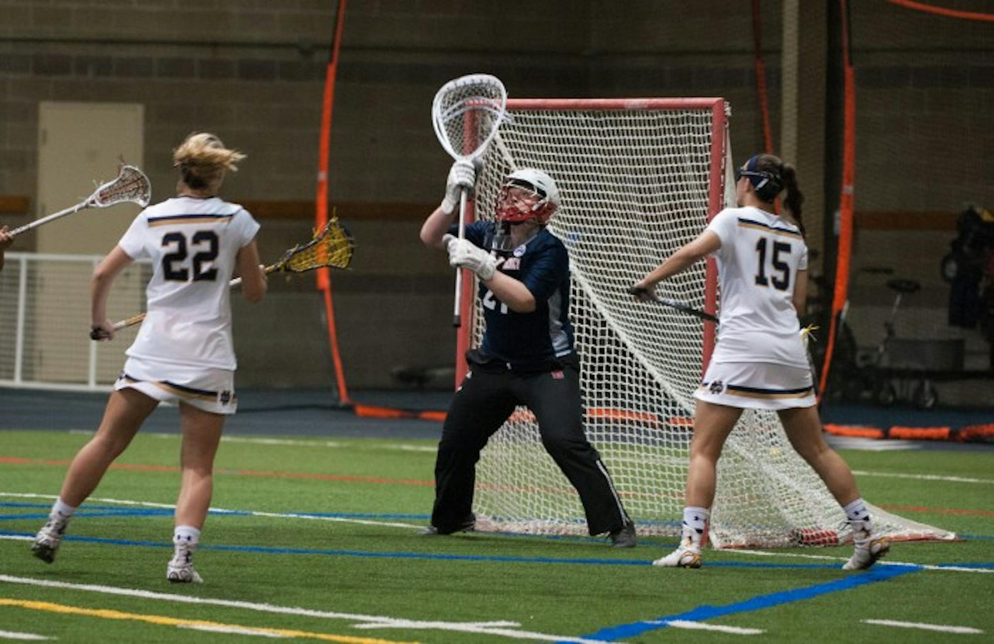 Irish senior attack Cortney Fortunato pressures the goalkeeper during Notre Dame's 24-9 victory over Detriot Mercy on Saturday at Loftus Sports Complex.