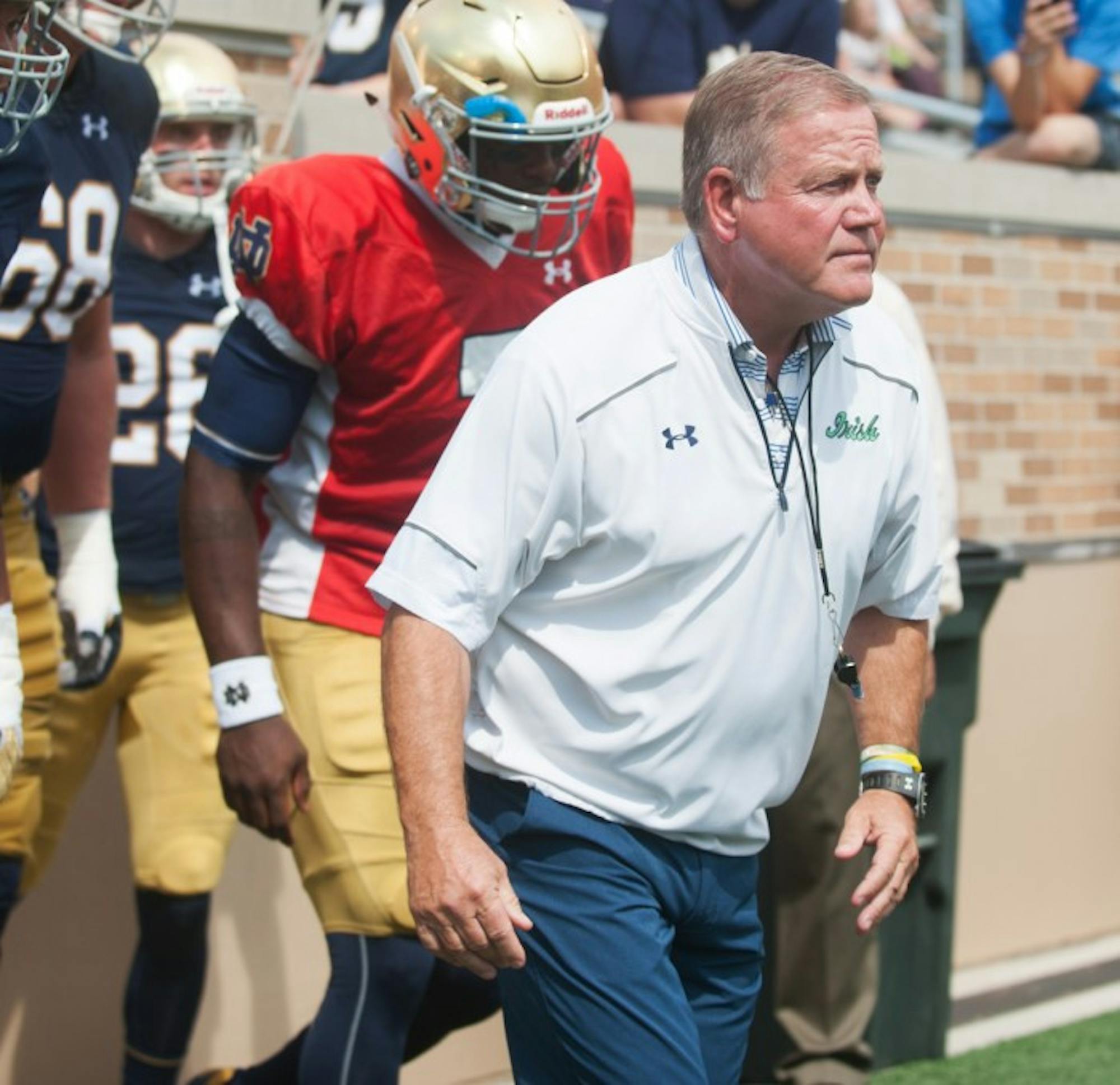 Irish head coach Brian Kelly takes the field during the New and Gold scrimmage Sunday at the newly-renovated Notre Dame Stadium.