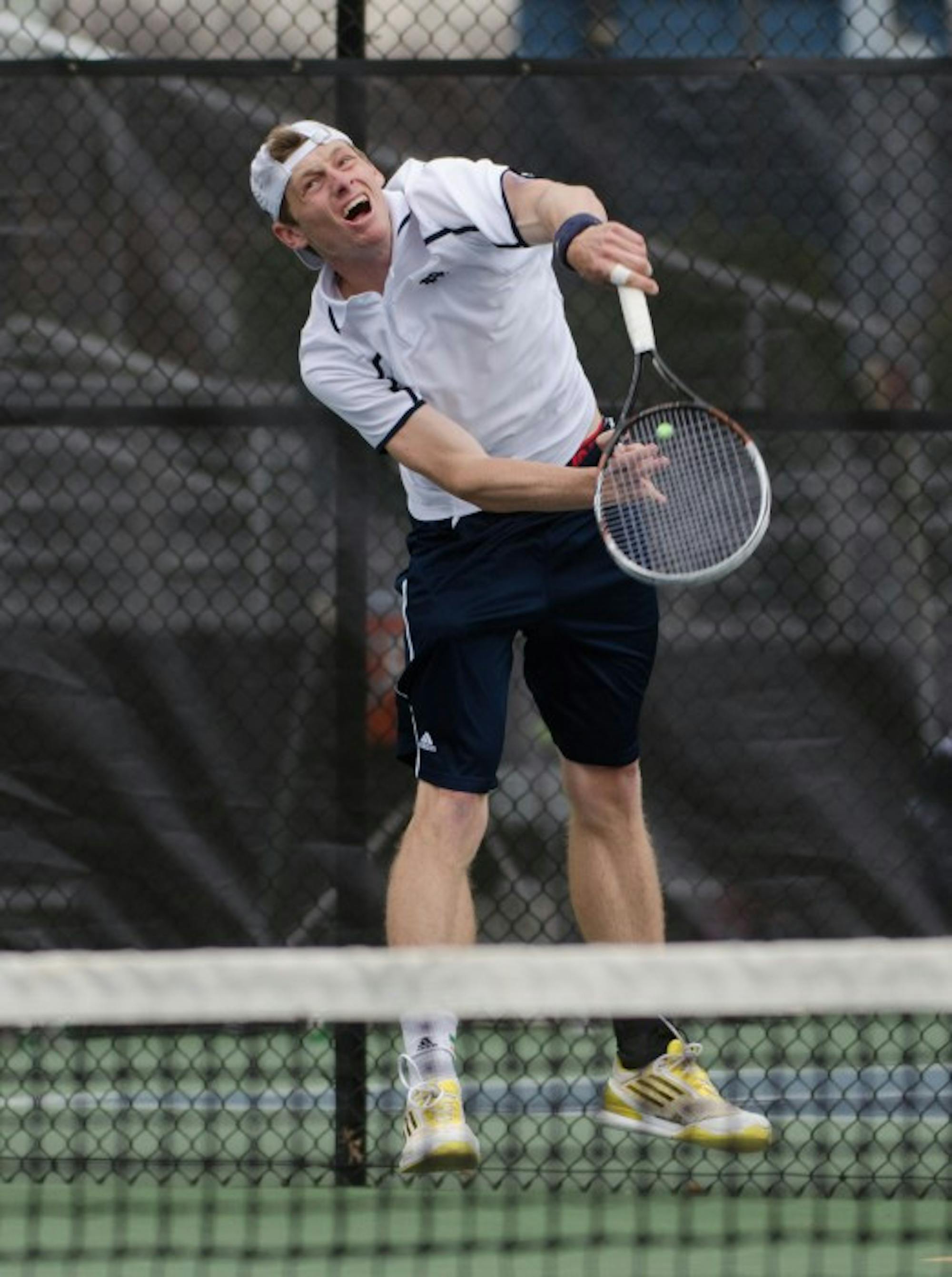 Irish junior Alex Lawson launches a serve during Notre Dame’s match with Florida State on April 3 at Eck Tennis Pavilion.