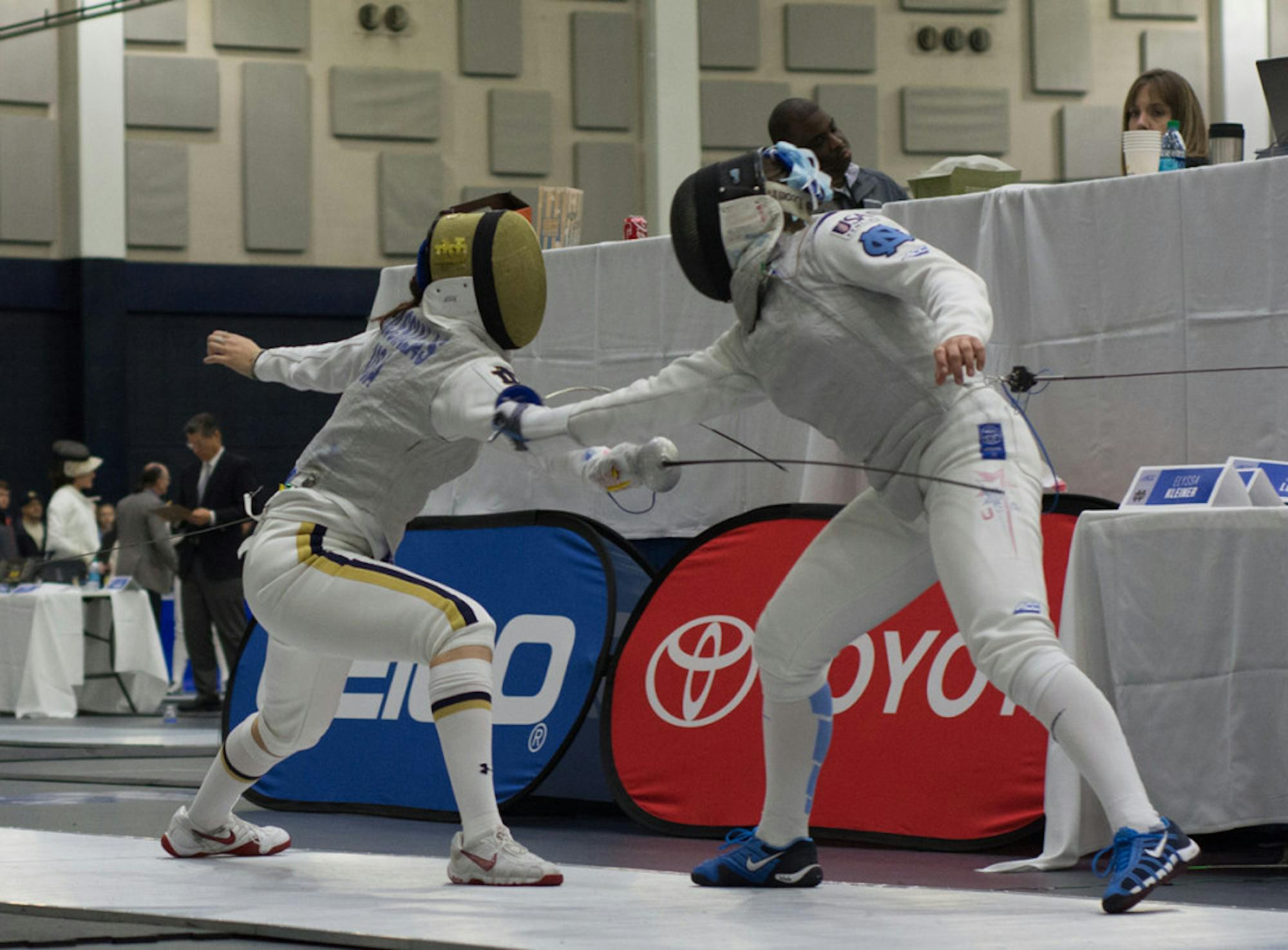 Irish junior foilist Sabrina Massialas lunges at her opponent during Notre Dame’s victory at the ACC championships on Feb. 27, 2016, at the Castellan Family Fencing Center.