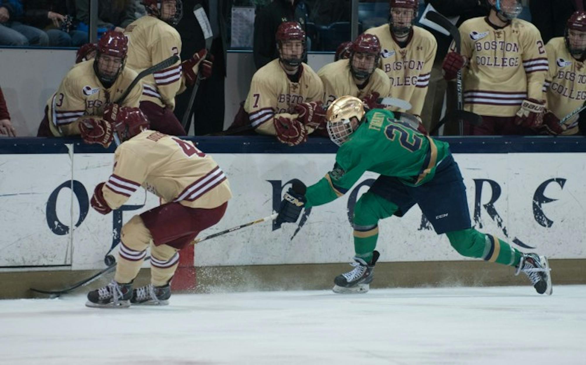 Senior center Steven Fogarty fights for a loose puck during a 2-0 loss to Boston College on Feb. 28 at Compton Family Ice Arena. Fogarty tallied nine goals and 12 assists during the 2014-2015 season.