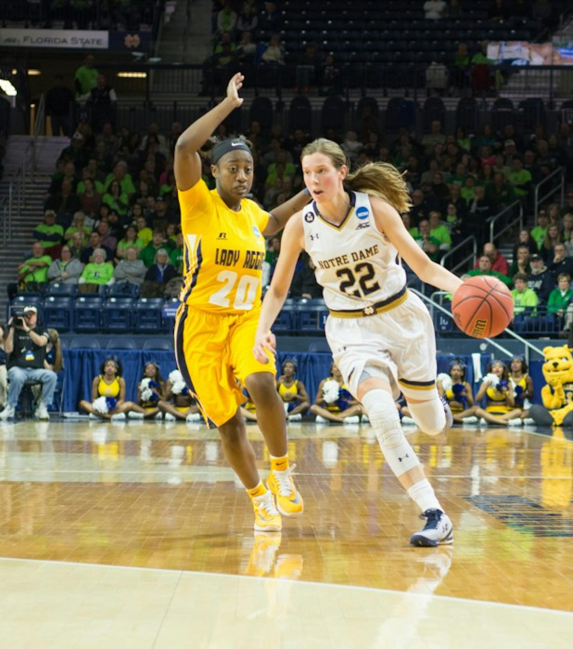 Irish graduate student guard Madison Cable dribbles around a North Carolina A&T defender during Notre Dame's 95-61 win in the first round of the NCAA tournament Saturday at Purcell Pavilion.