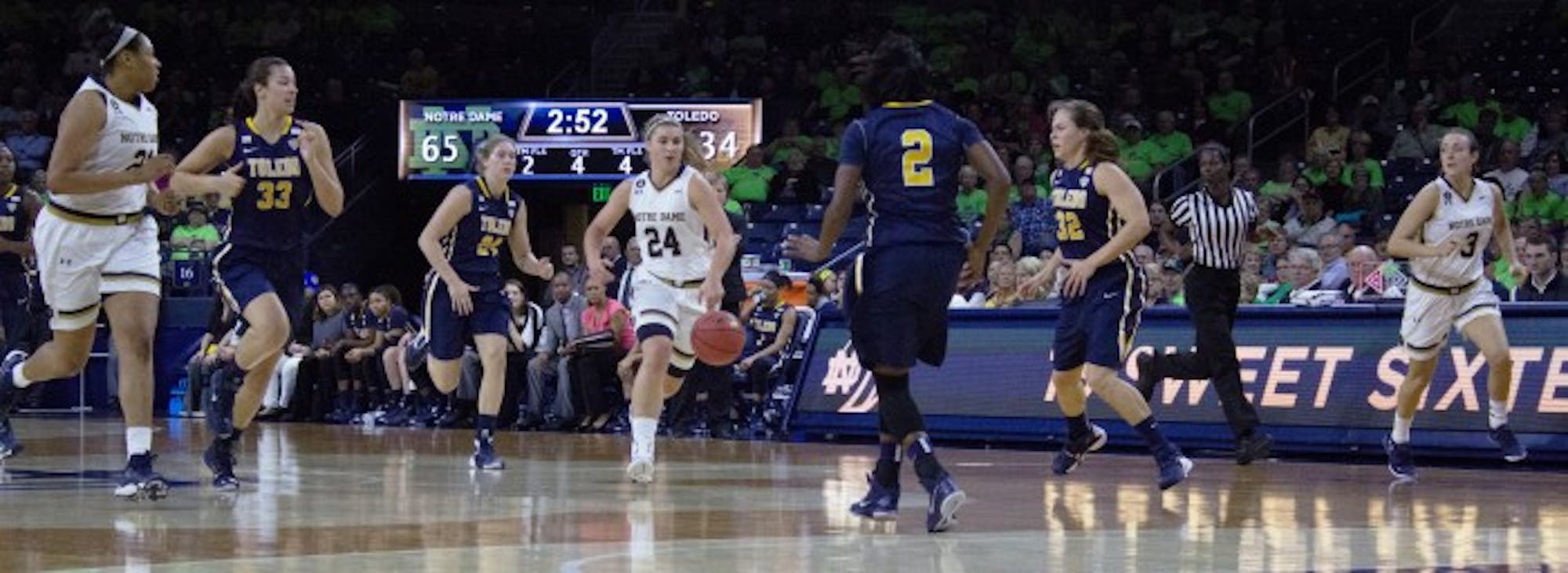 Irish senior guard Hannah Huffman, center, leads a fast break with junior forward Kristina Nelson, left, and freshman guard Marina Mabrey, right, during Notre Dame’s 74-39 win over Toledo on Nov. 18 at Purcell Pavilion. Huffman had a team-high seven rebounds, while Mabrey scored six points and Nelson added four points in the win.