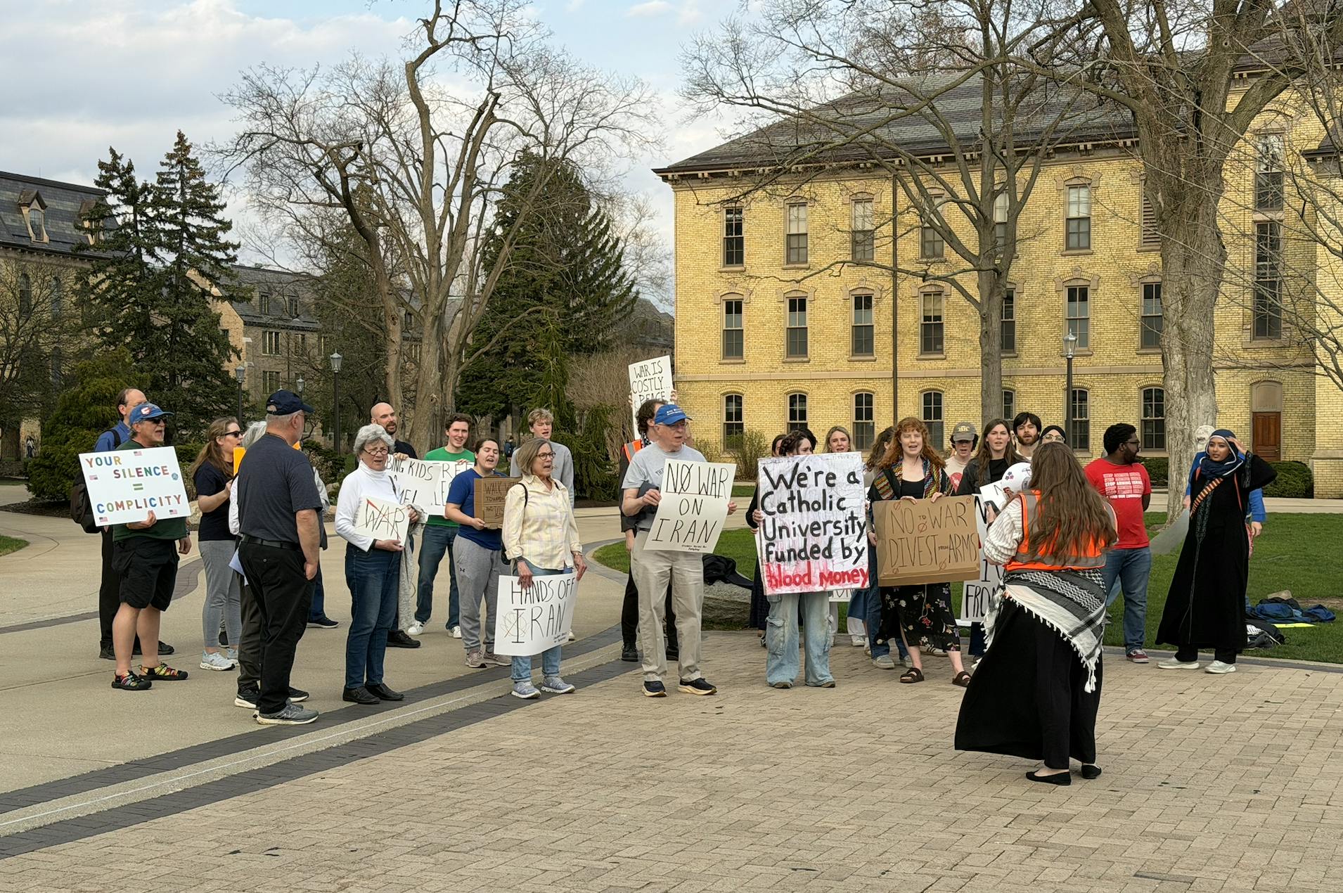 Community members gather alongside students for protest against University's connections to ongoing wars