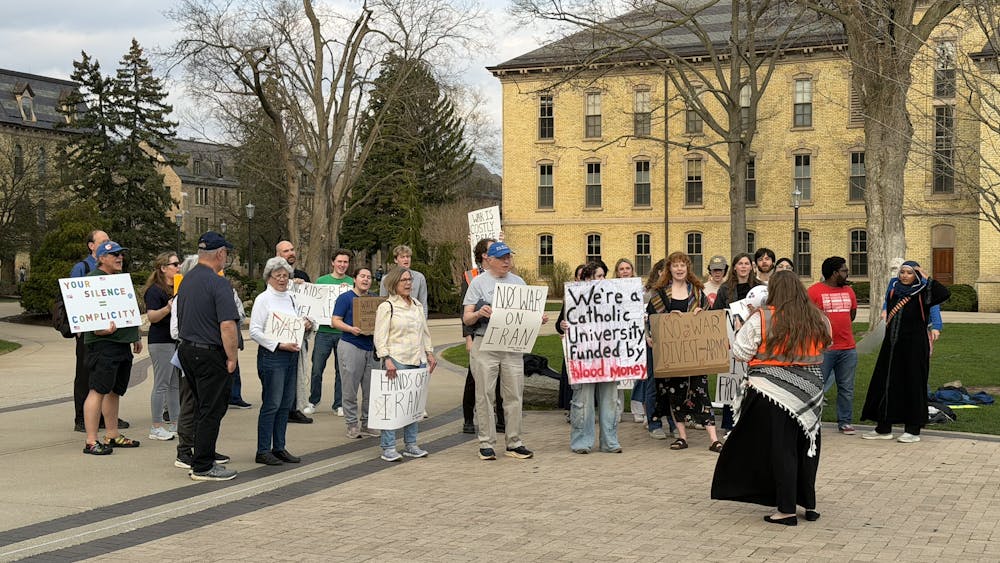 Community members gather alongside students for protest against University's connections to ongoing wars