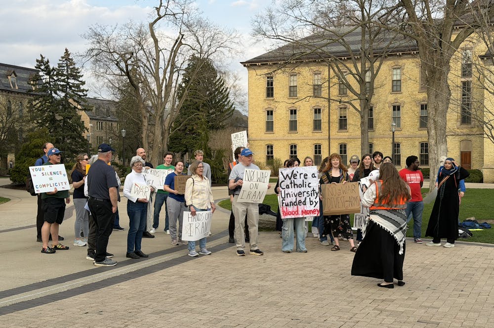 Community members gather alongside students for protest against University's connections to ongoing wars