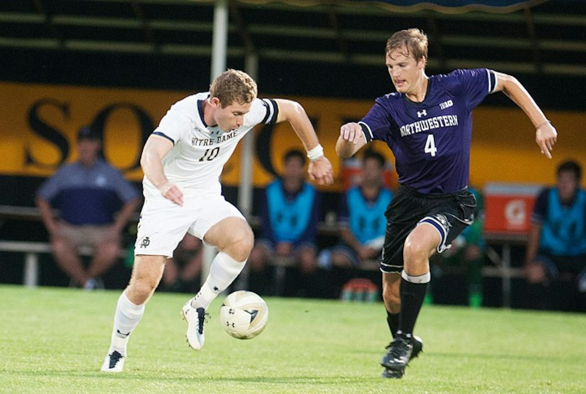 Irish senior forward Jon Gallagher evades a defender during Notre Dame's 2-1 overtime win over Northwestern on Oct. 3 at Alumni Stadium. The tri-captain scored the winning goal in overtime for the Irish.