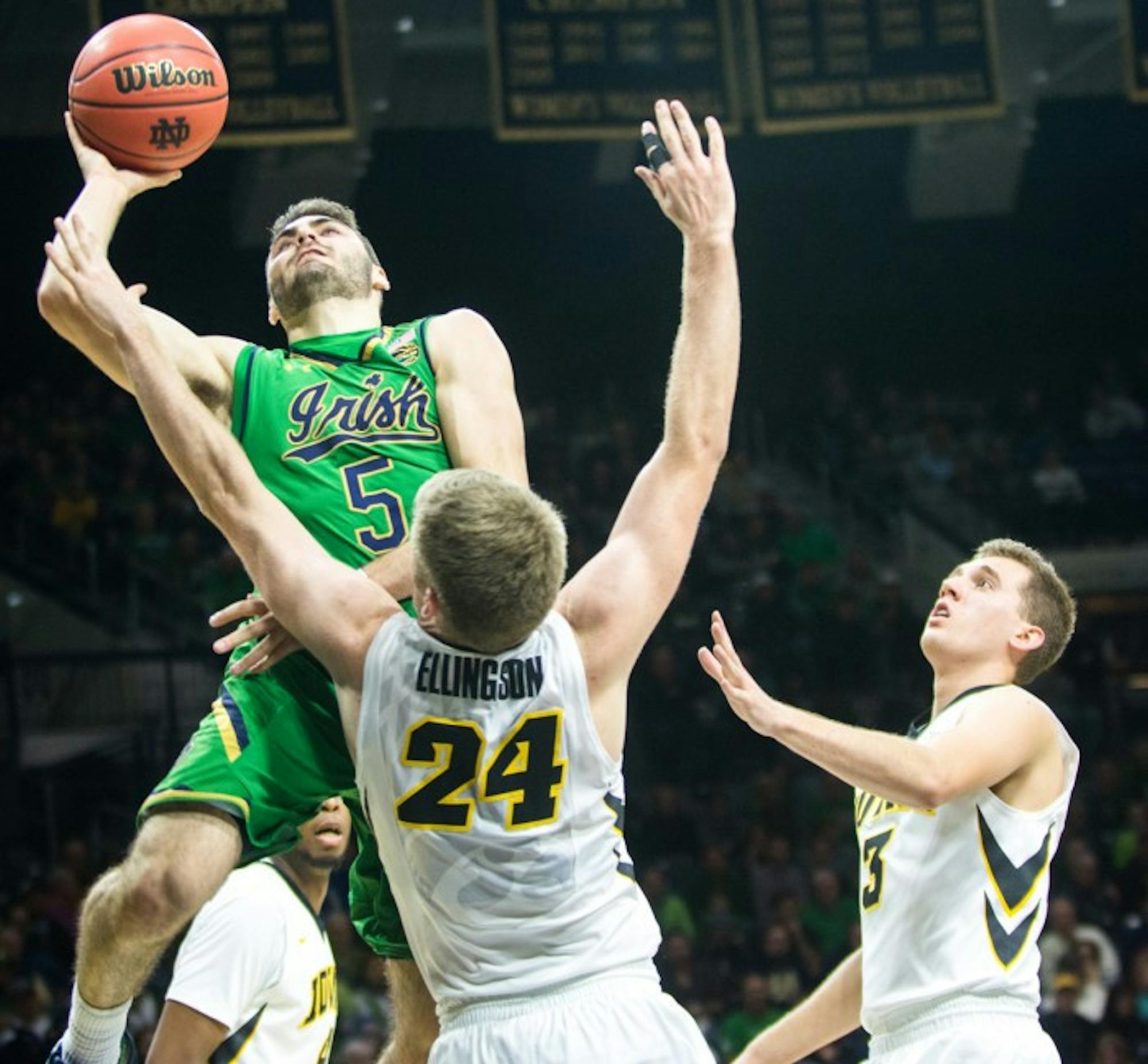 Irish junior guard Matt Farrell jumps into a defender during Notre Dame’s 92-78 victory over Iowa on Tuesday night at Purcell Pavilion. Farrell had 16 points and seven assists in the contest.