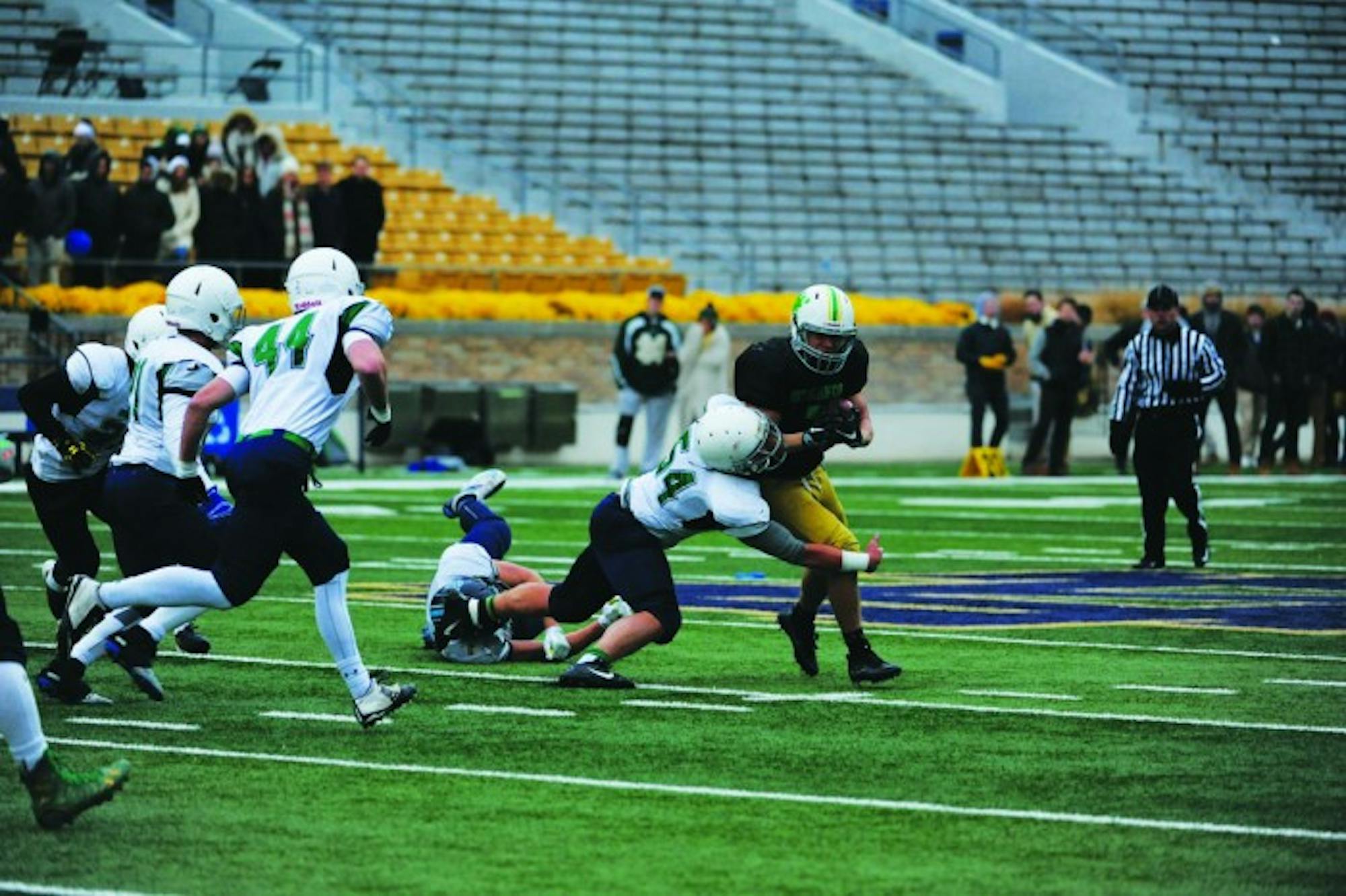 A Duncan defender tackles a Stanford running back during the men’s interhall championship game on Nov. 20 at Notre Dame Stadium. Both Stanford and Duncan are undefeated so far in the 2017 season.