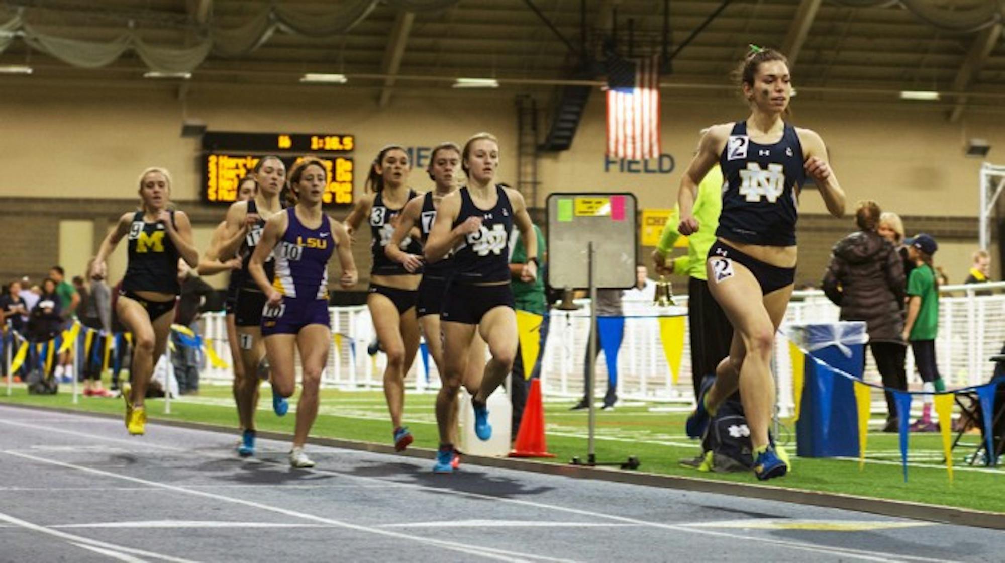 Irish sophomore Jessica Harris, far right, leads a pack of runners during the 800-meter run Saturday. Harris was a part of the distance medley relay  team that posted a qualifying time for nationals at the meet.