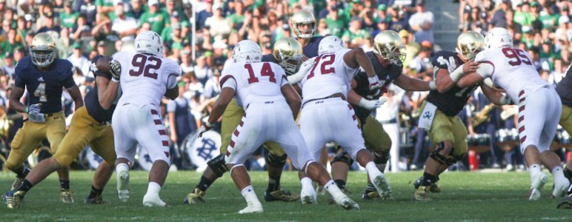 The Temple defense tries to stop Notre Dame during the teams’ meeting Aug. 31, 2013, a 28-6 Irish victory. The Owls have raced out to a 7-0 start this season behind one of the  nation’s best defensive units; Temple is allowing just 14.6 points per game this season, eighth-best in the country, and 308 yards per game.