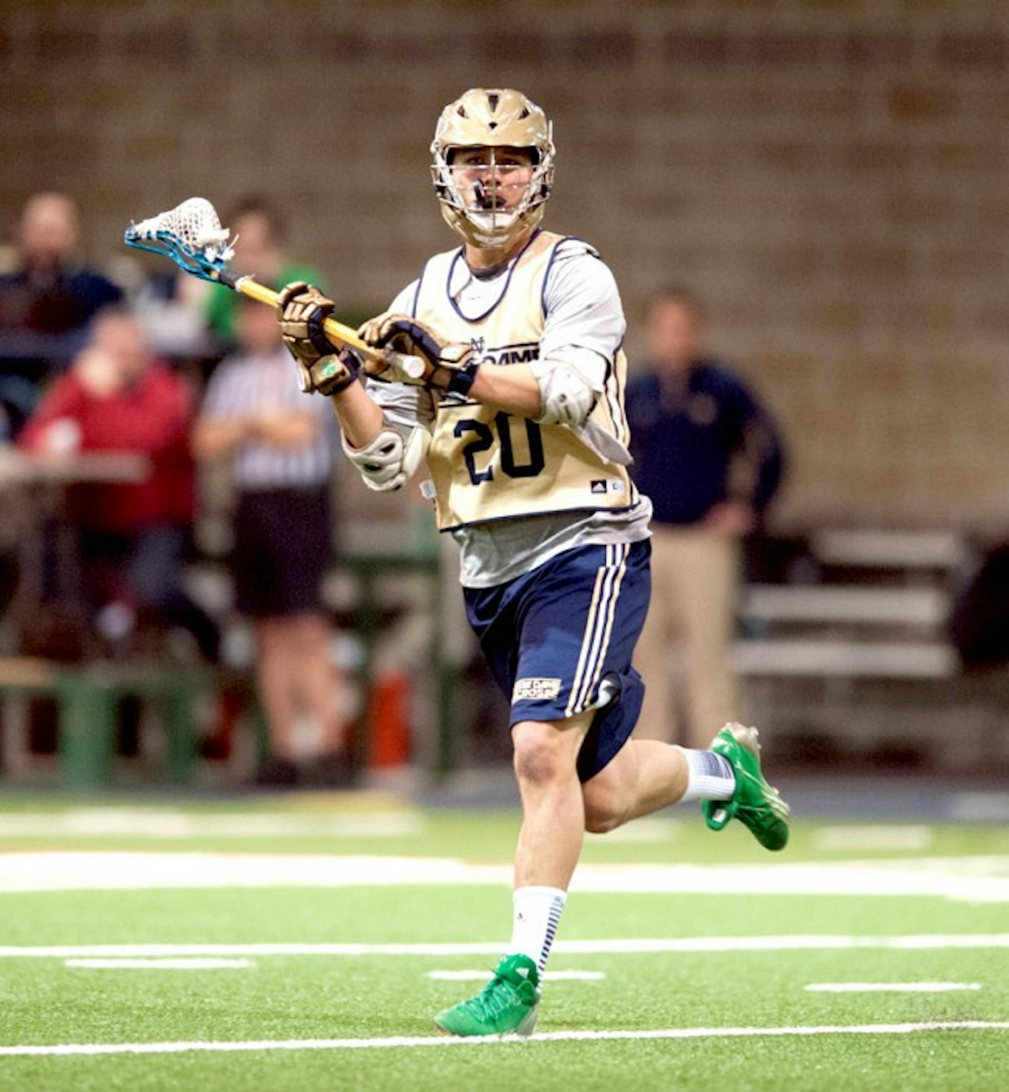 Irish junior midfield Nick Ossello looks for an open teammate during an exhibition game against Bellarmine on Feb. 2.