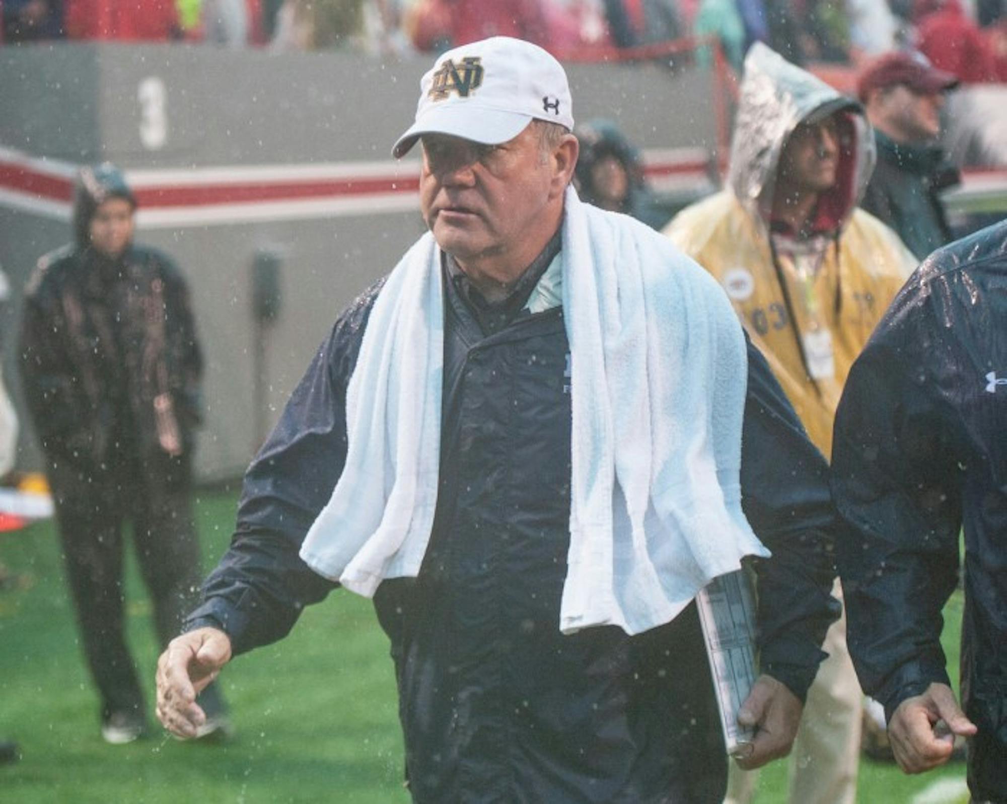 Irish head coach Brian Kelly walks off the field at Carter-Finley Stadium in Notre Dame's 10-3 loss to North Carolina State.