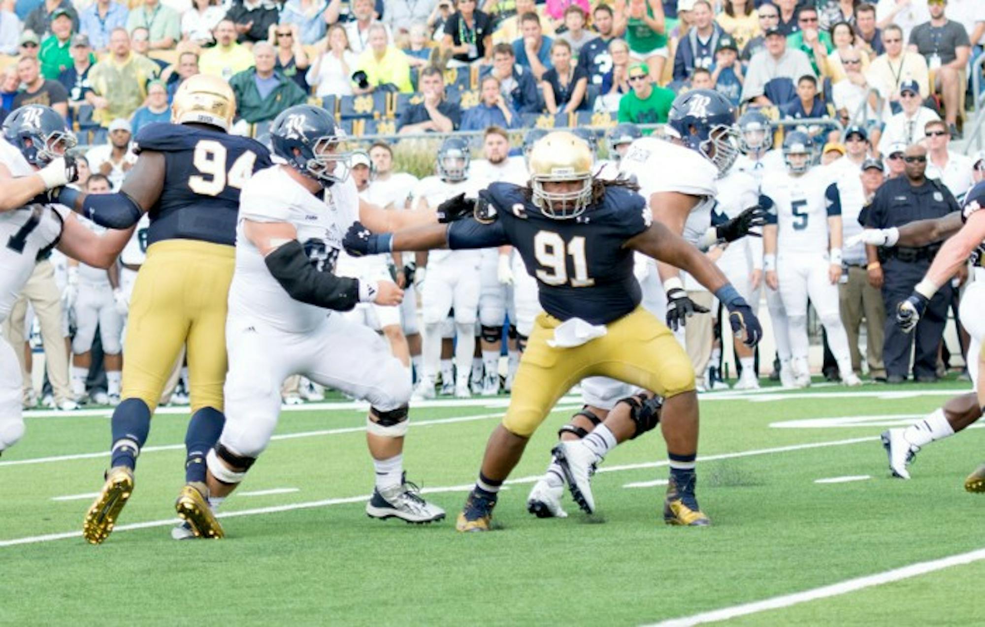 Irish senior defensive end and captain Sheldon Day works past his blocker in an attempt to get to the ball carrier during Notre Dame’s 48-17 victory over Rice.