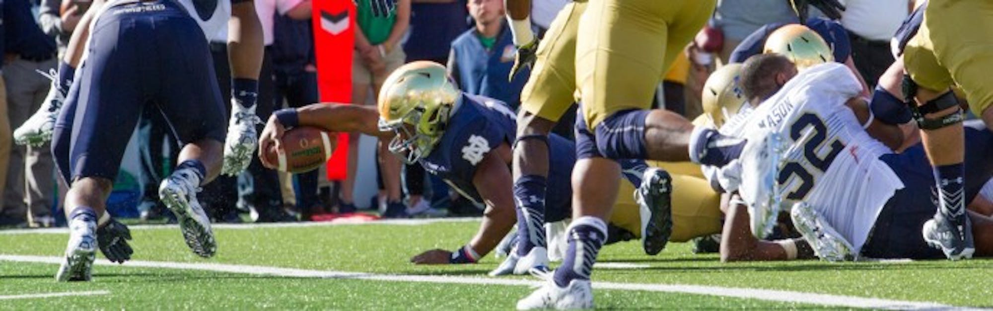 Irish sophomore quarterback DeShone Kizer stretches for the goal line during Notre Dame’s 41-24 victory. Kizer was ruled short on the play after a review, but he scored on a quarterback sneak the very next play.