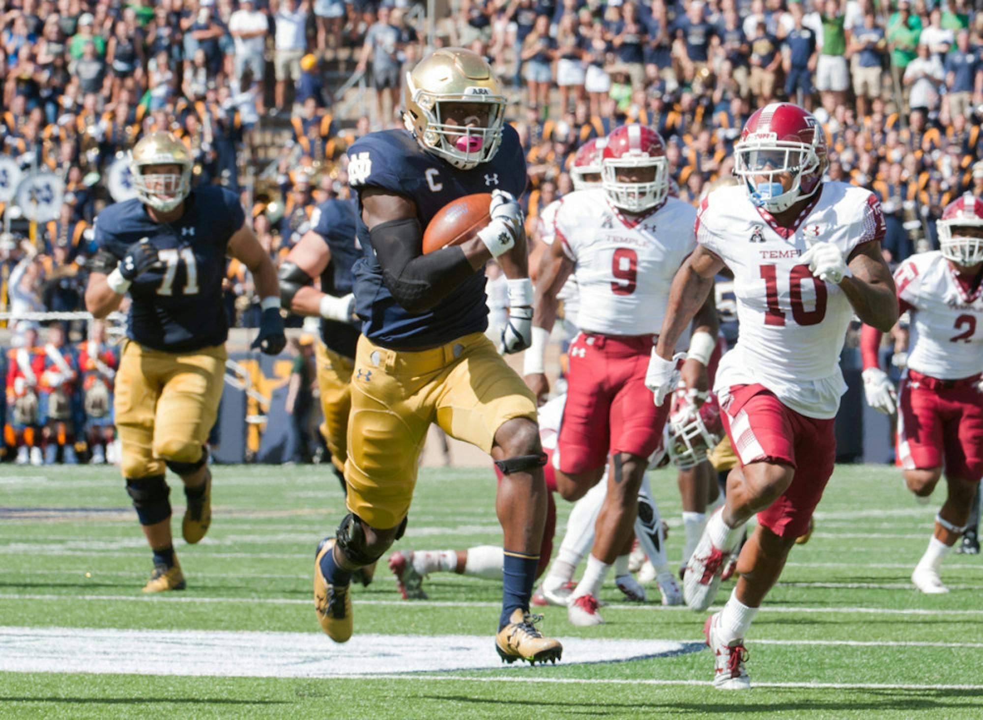 Josh Adams runs upfield during Notre Dame’s 49-16 win over Temple on Saturday at Notre Dame Stadium. Adams has nine 100-yard rushing performances over the course of his Notre Dame career.