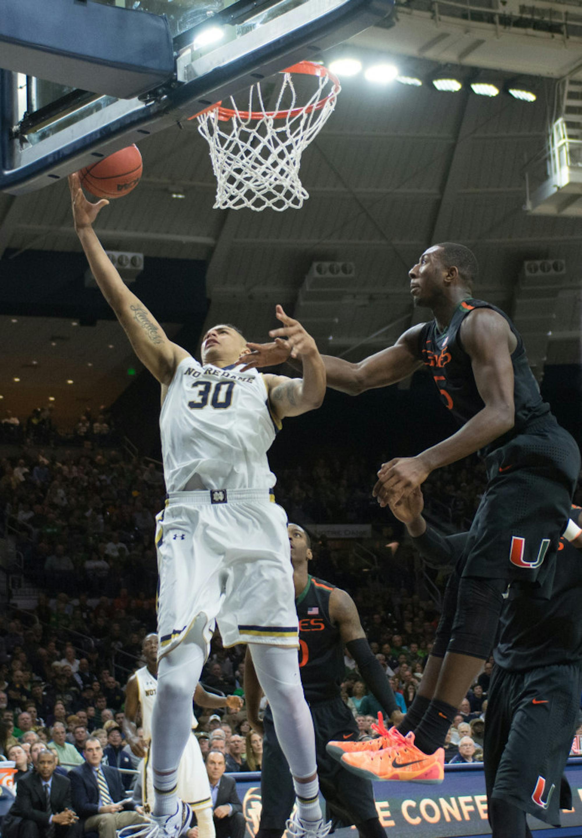 Irish junior forward Zach Auguste jumps up for a layup in a 75-70 Irish win against Miami on Saturday at Purcell Pavilion.