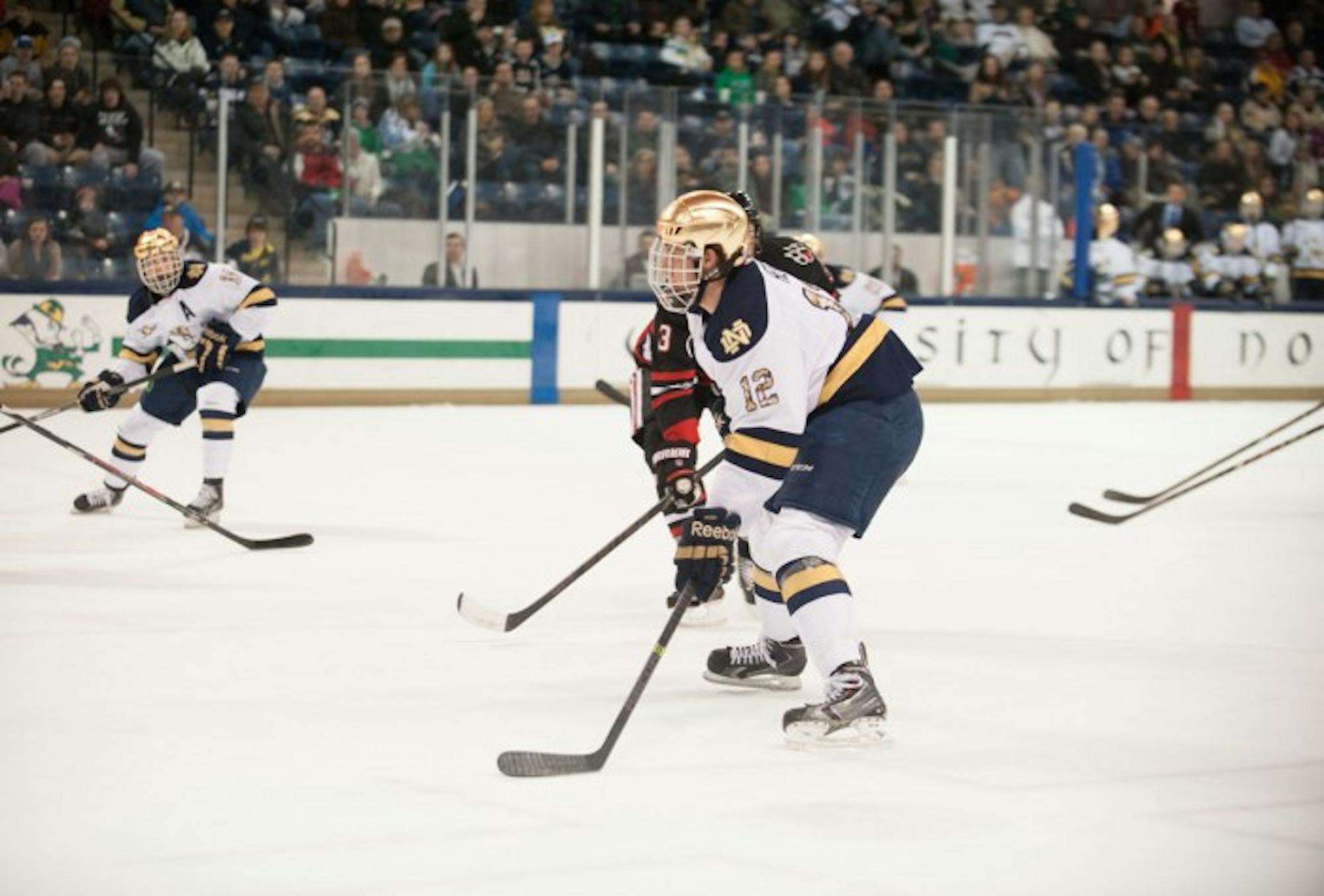 Irish junior left wing Sam Herr pursues the puck in Notre Dame’s 4-0 loss to Northeastern Jan. 24 at Compton Family Ice  Arena.