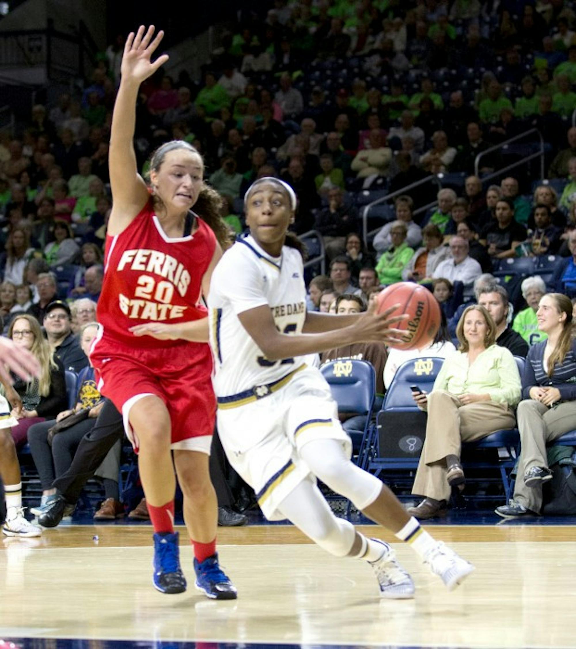Irish junior guard Jewell Loyd cuts by a Ferris State defender during Notre Dame’s 92-32 rout over the Bulldogs on Wednesday night. The game was Notre Dame’s only exhibition contest of the season.