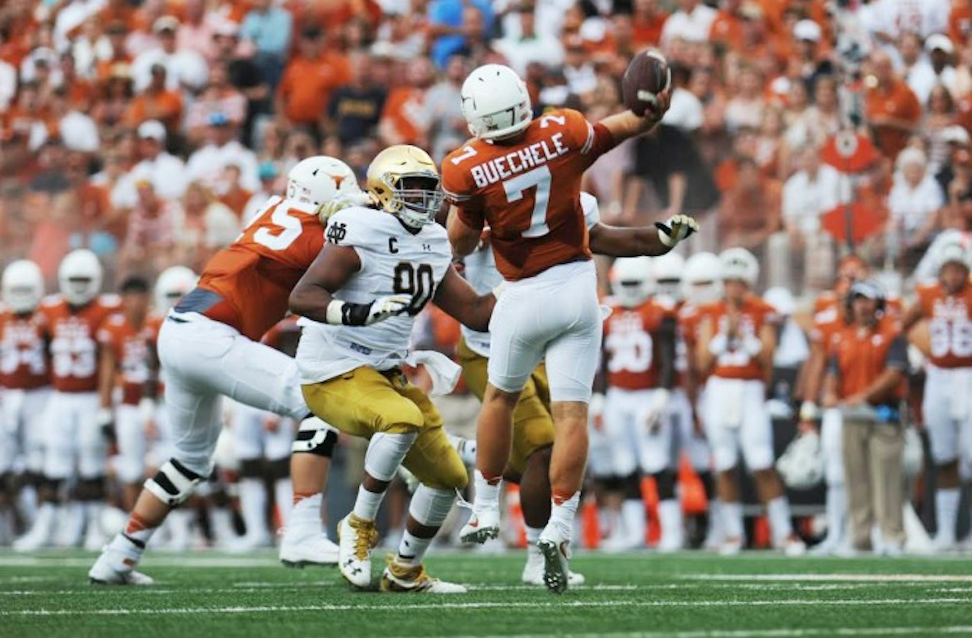 Texas freshman quarterback Shane Buechele gets ready to throw in Texas’ 50-47 win. Buechele threw for 280 yards on 16-of-26 passing with two touchdowns in addition to 33  rushing yards. Texas senior quarterback Tyrone Swoopes also contributed 53 rushing yards and three touchdowns as the Longhorns had 517 yards of total offense and 26 first downs.