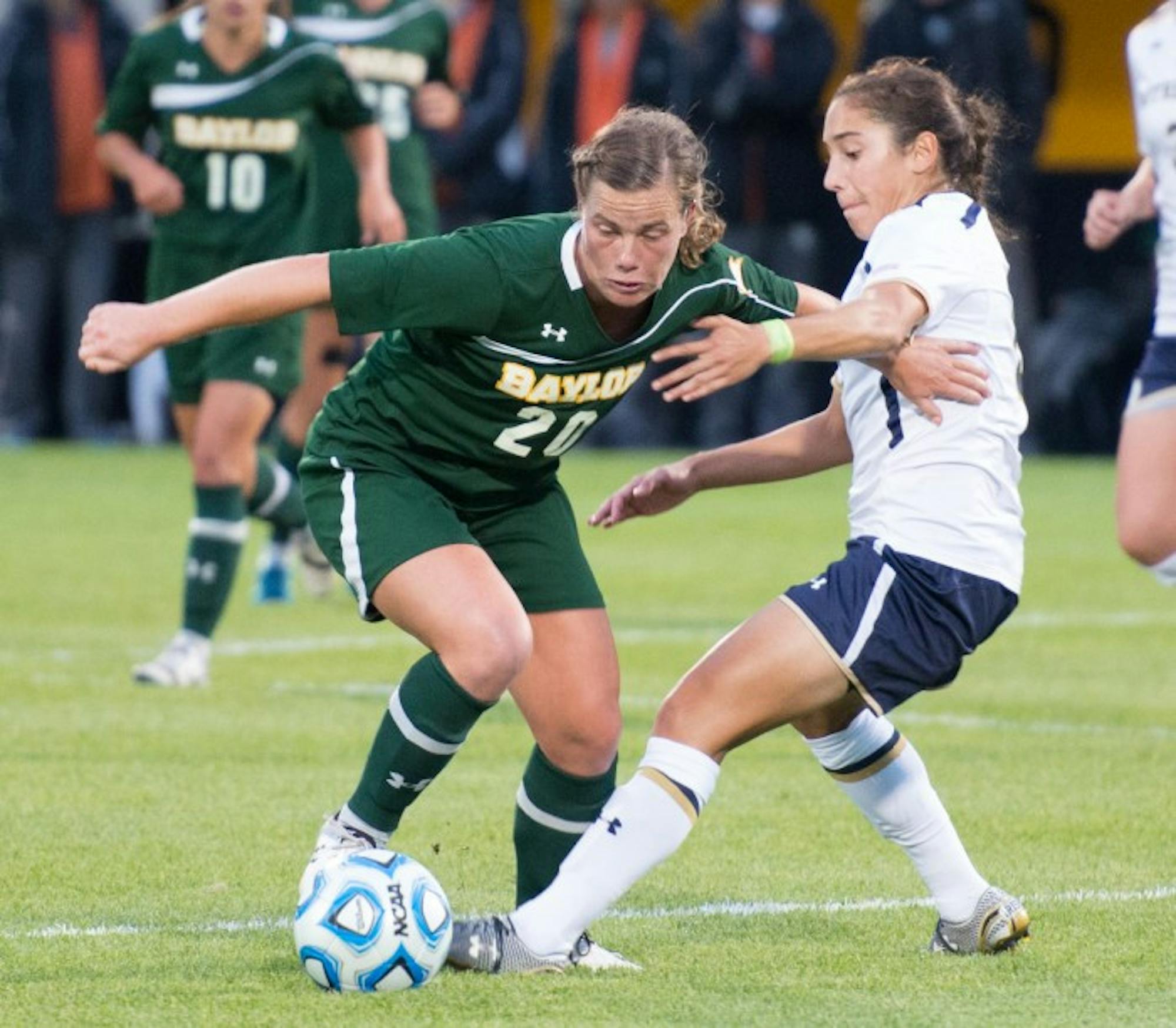 Irish freshman defender Sabrina Flores tangles with a Baylor forward during Notre Dame’s 1-0 win over the Bears on Sept. 12.