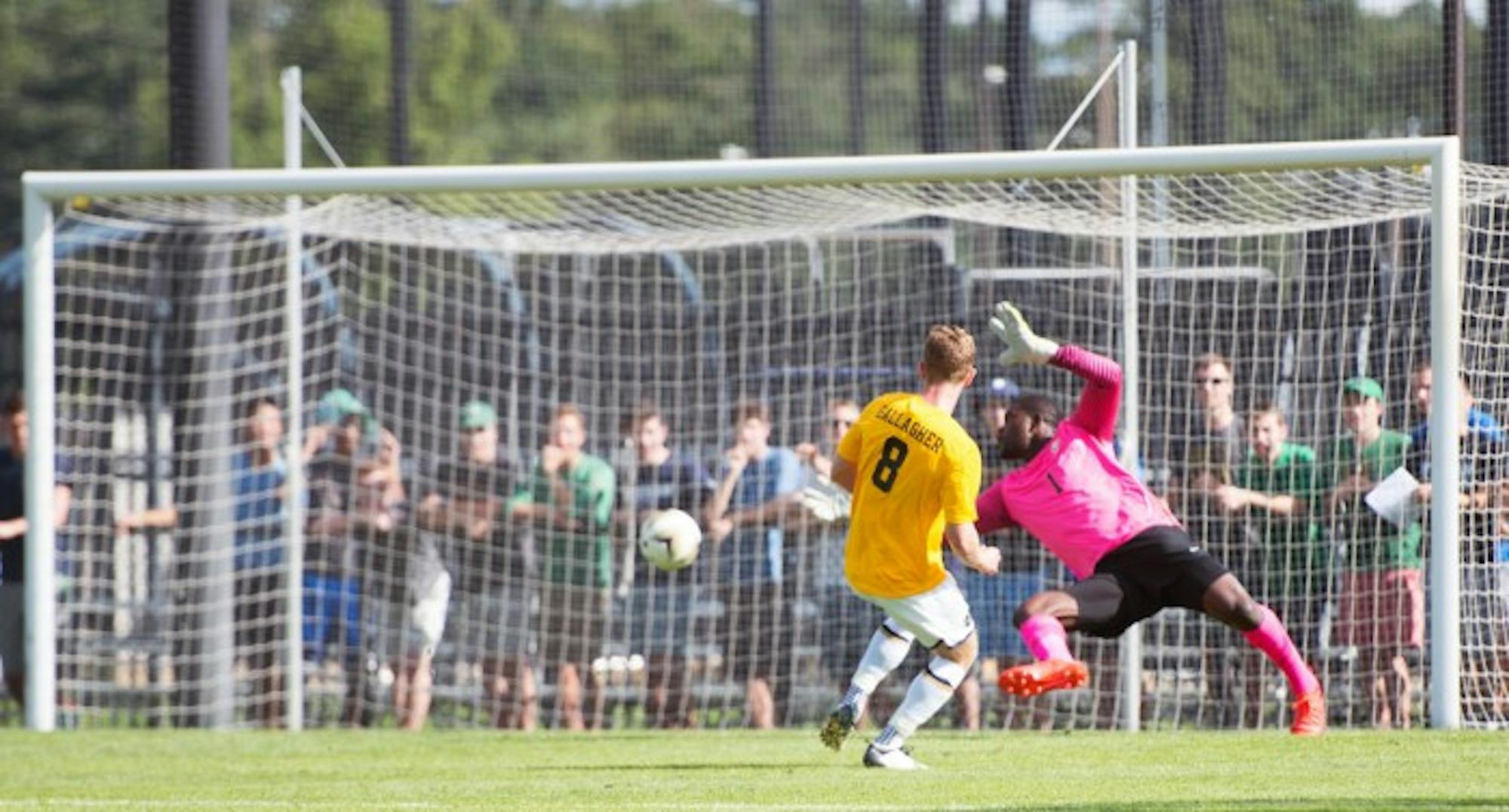 Irish junior forward Jon Gallagher scores against the Valparaiso goalkeeper during Notre Dame’s 1-1 draw with the Crusaders at Alumni Stadium on Aug. 22. Gallagher led the Irish with 9 goals scored last season.