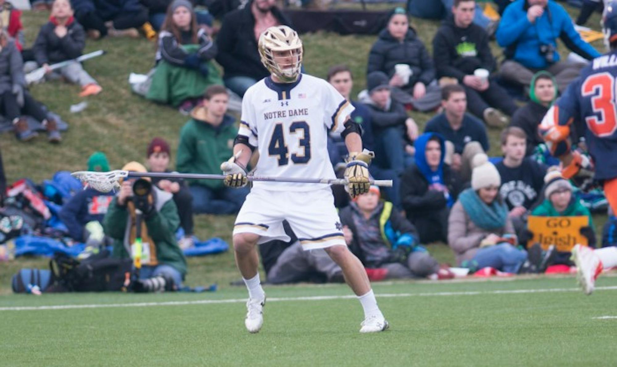 Irish senior defender Matt Landis looks to pass the ball during Notre Dame's 8-7 victory in overtime against Virginia on March 19.
